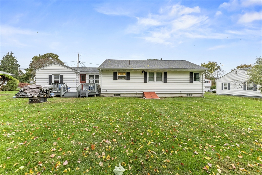 337 Lepes Road Somerset, MA 02726 - Photo 25 of 29 a front view of a house with a garden and plants