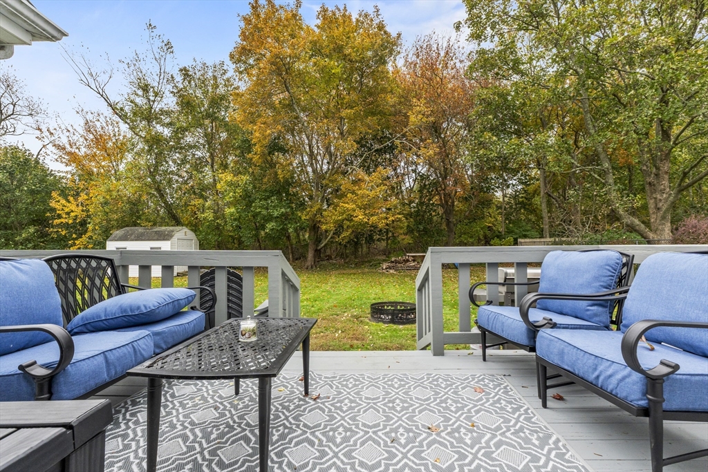 337 Lepes Road Somerset, MA 02726 - Photo 26 of 29 a roof deck with a table and chairs