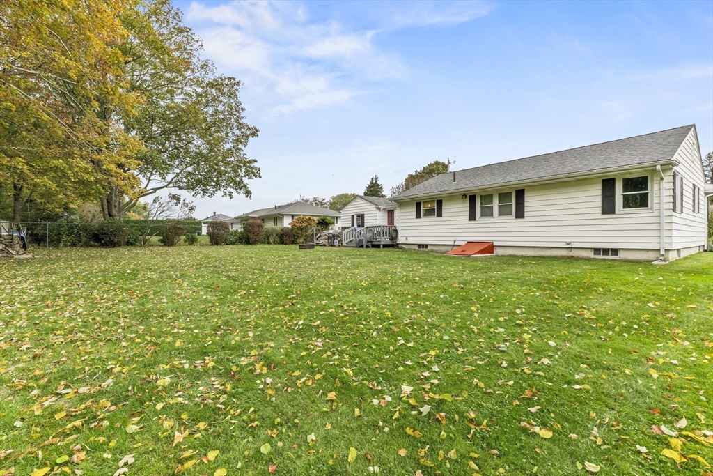 337 Lepes Road Somerset, MA 02726 - Photo 27 of 29 a front view of house with yard and green space
