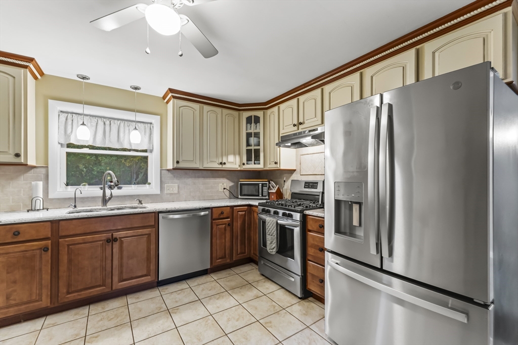 337 Lepes Road Somerset, MA 02726 - Photo 8 of 29 a kitchen with stainless steel appliances granite countertop a refrigerator and a sink