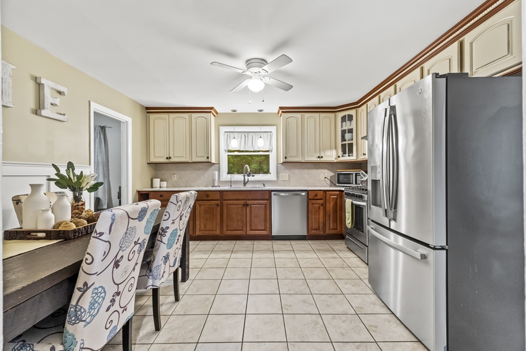 337 Lepes Road Somerset, MA 02726 - Photo 10 of 29 a kitchen with stainless steel appliances granite countertop a refrigerator sink and cabinets