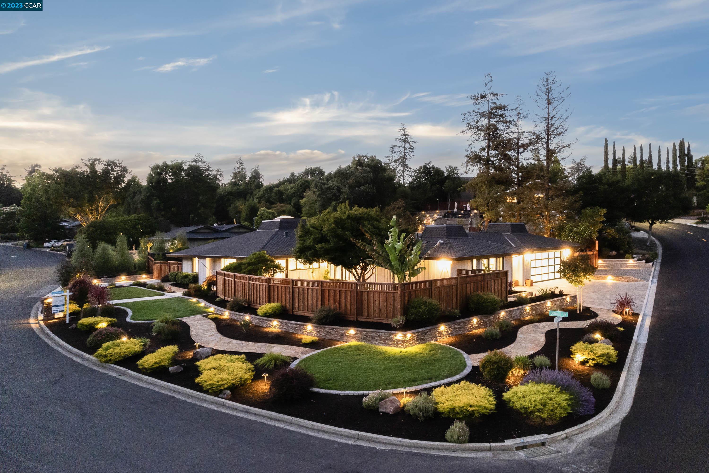 a view of a swimming pool with outdoor seating