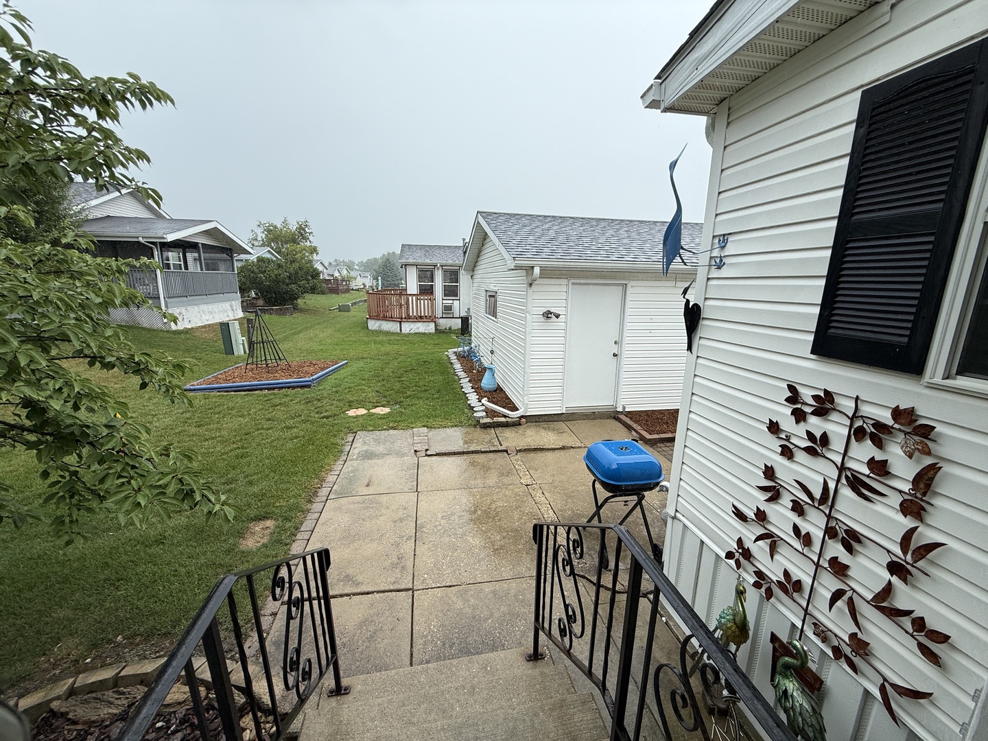 69 Petunia Circle Matteson, IL 60443 - Photo 11 of 25 a view of backyard from deck having patio