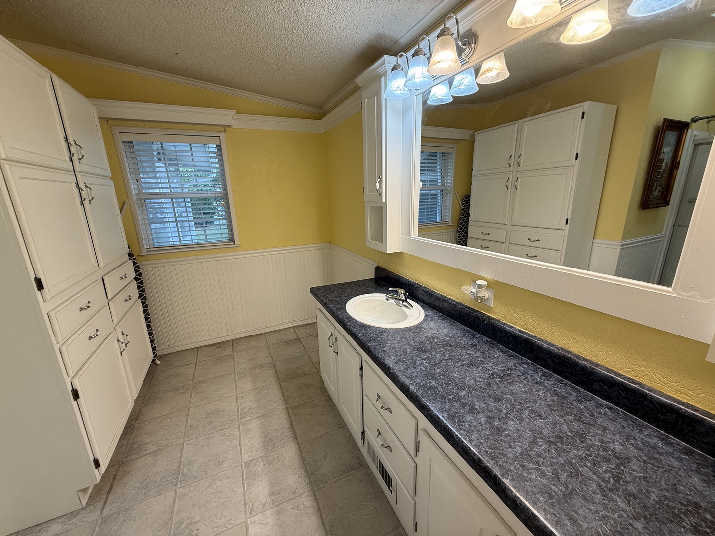 69 Petunia Circle Matteson, IL 60443 - Photo 17 of 25 a bathroom with a granite countertop sink and a mirror