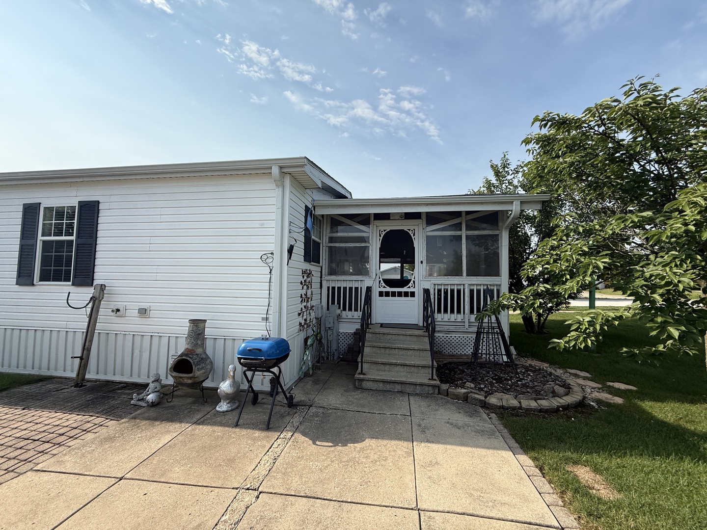 69 Petunia Circle Matteson, IL 60443 - Photo 21 of 25 a view of house with patio outdoor seating and yard