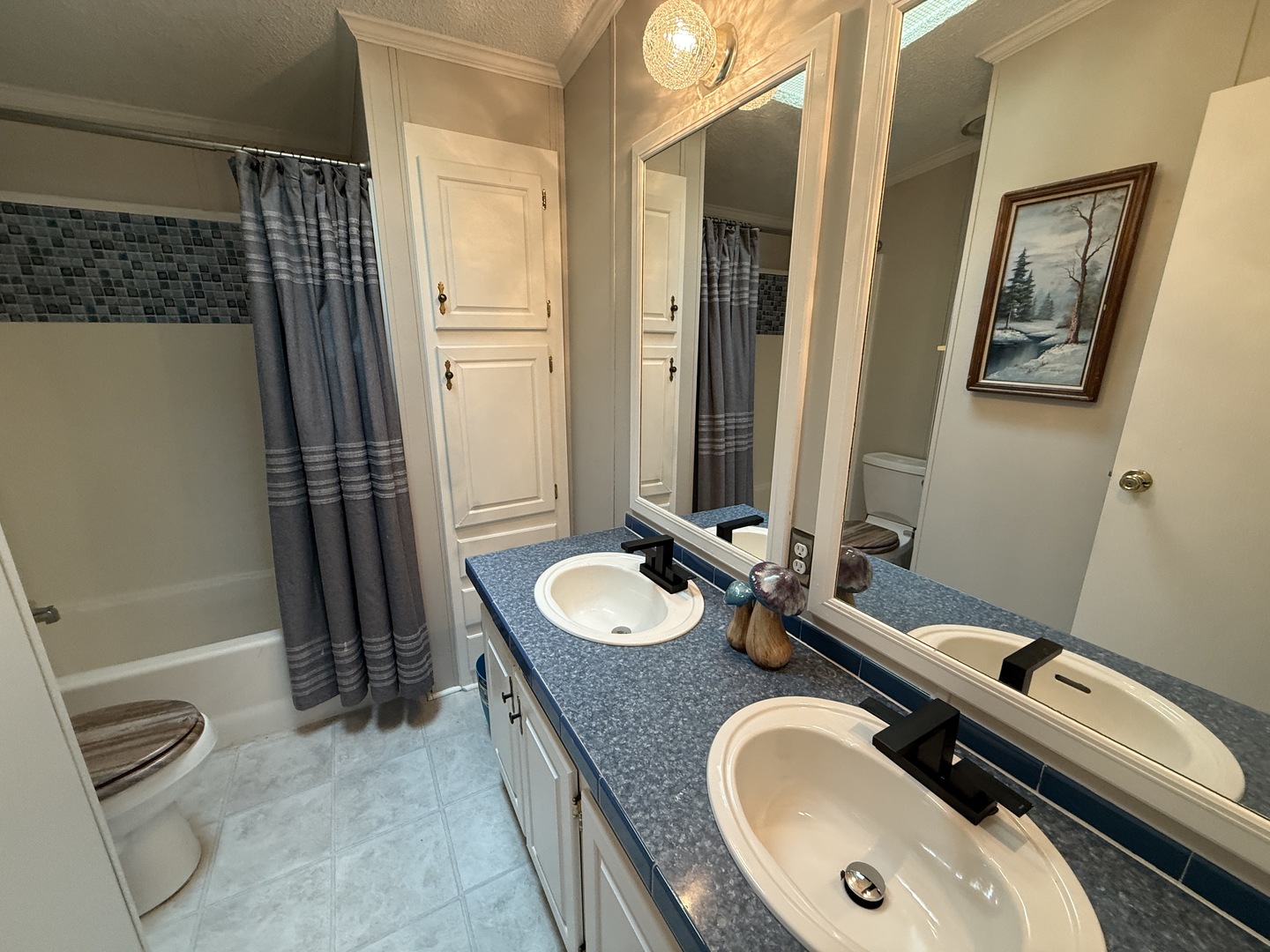 69 Petunia Circle Matteson, IL 60443 - Photo 9 of 25 a bathroom with a granite countertop sink and a mirror