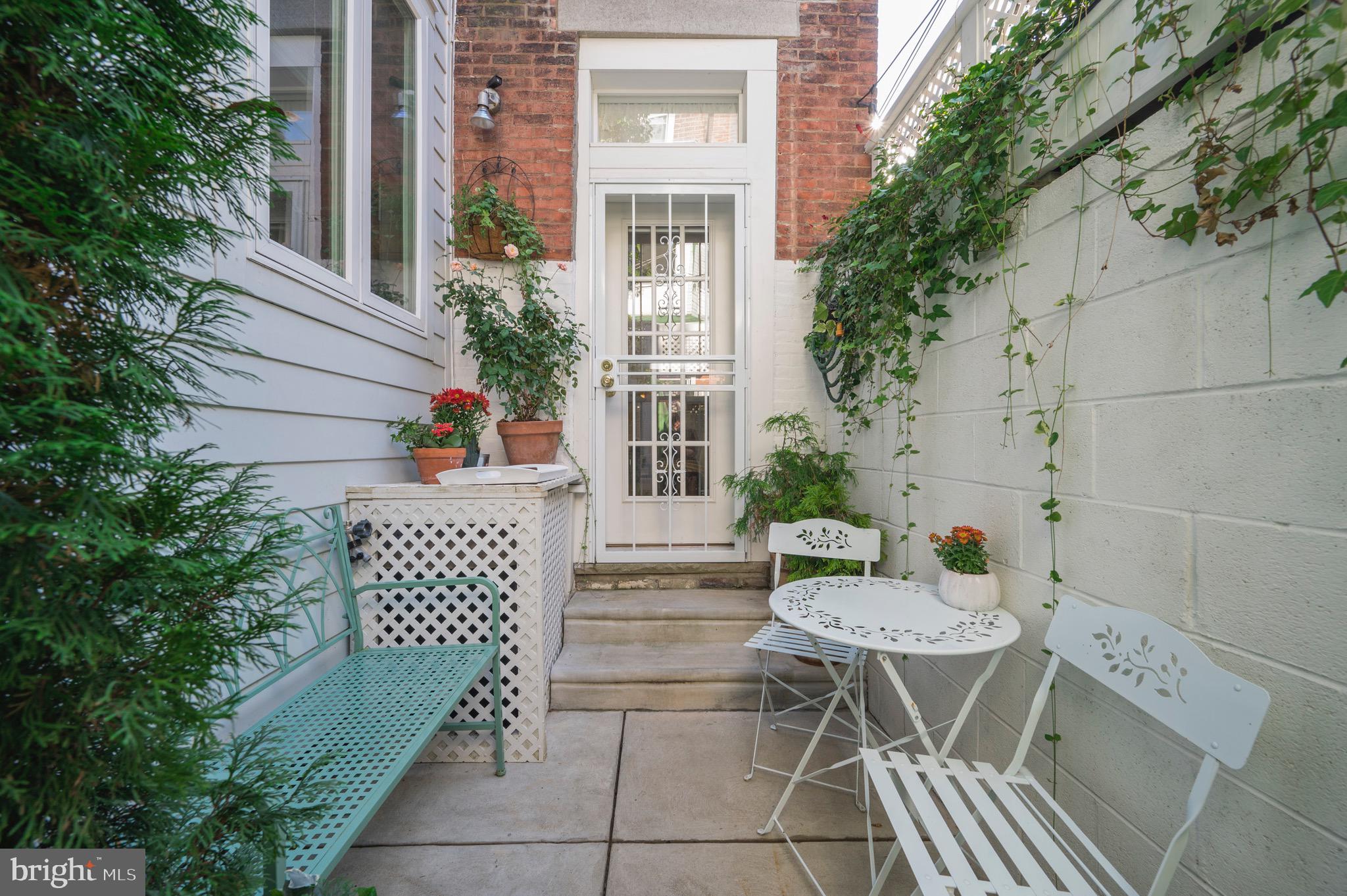 2051 Appletree Street Philadelphia, PA 19103 - Photo 12 of 36 Step out to a main-floor patio with ivy/plantings