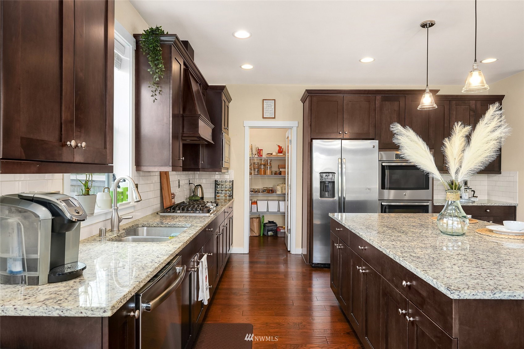 532 Ludwig Road Snohomish, WA 98290 - Photo 14 of 40 a kitchen with stainless steel appliances granite countertop a sink a stove and a wooden floors