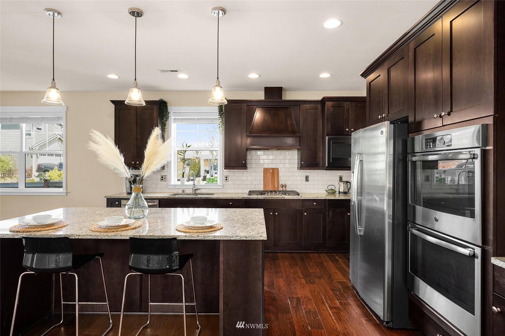 532 Ludwig Road Snohomish, WA 98290 - Photo 15 of 40 a kitchen with stainless steel appliances granite countertop a sink a stove and a refrigerator