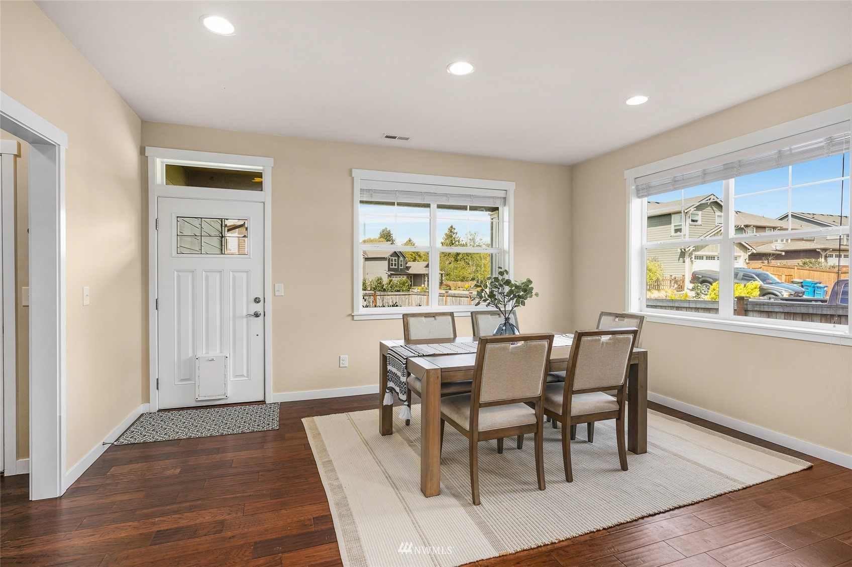 532 Ludwig Road Snohomish, WA 98290 - Photo 18 of 40 a view of a dining room with furniture a rug and wooden floor