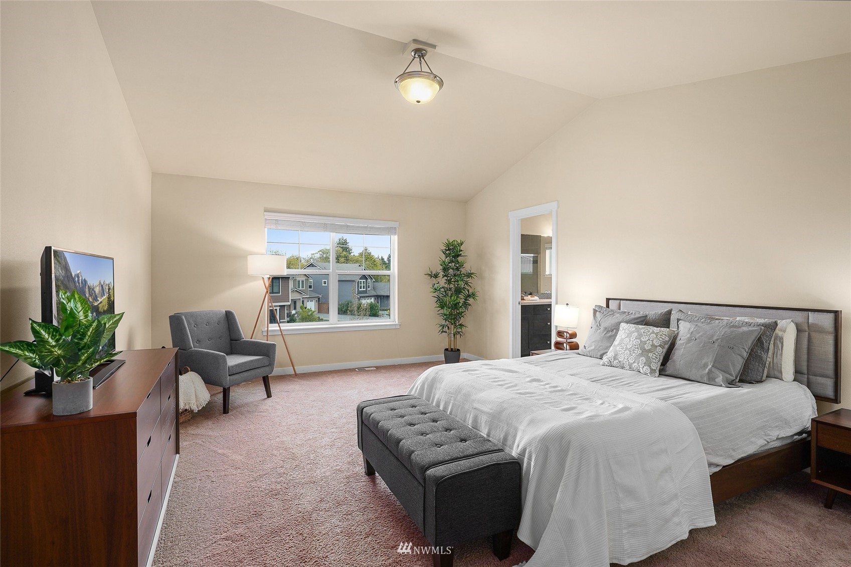 532 Ludwig Road Snohomish, WA 98290 - Photo 27 of 40 a bedroom with a large bed and windows