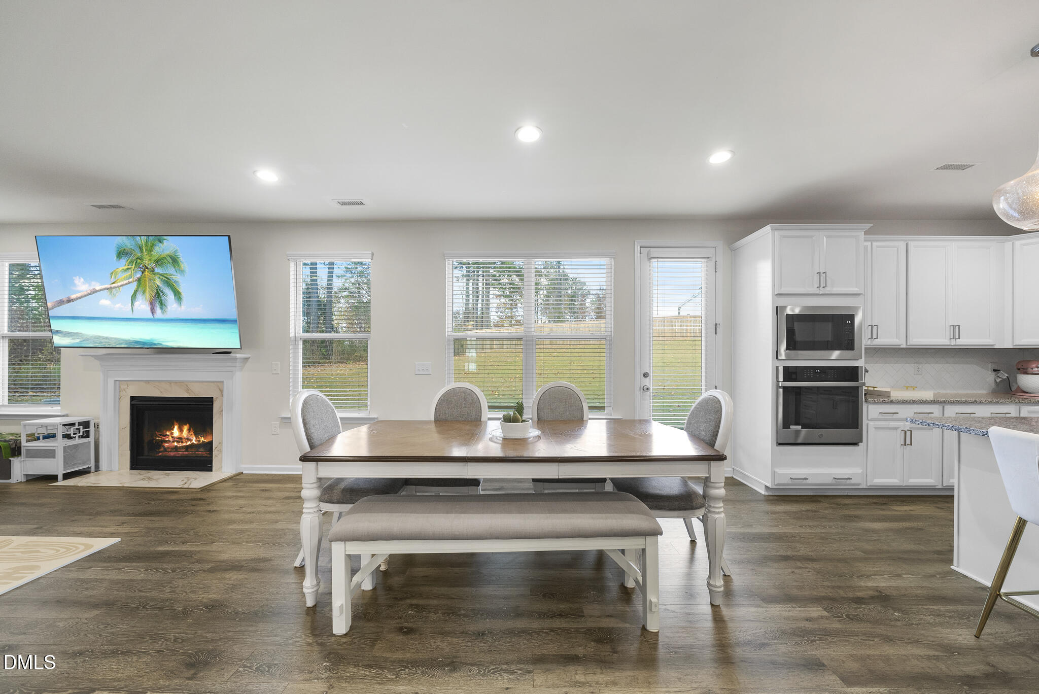 672 Millers Mark Avenue Wake Forest, NC 27587 - Photo 15 of 41 a living room with fireplace furniture and a wooden floor
