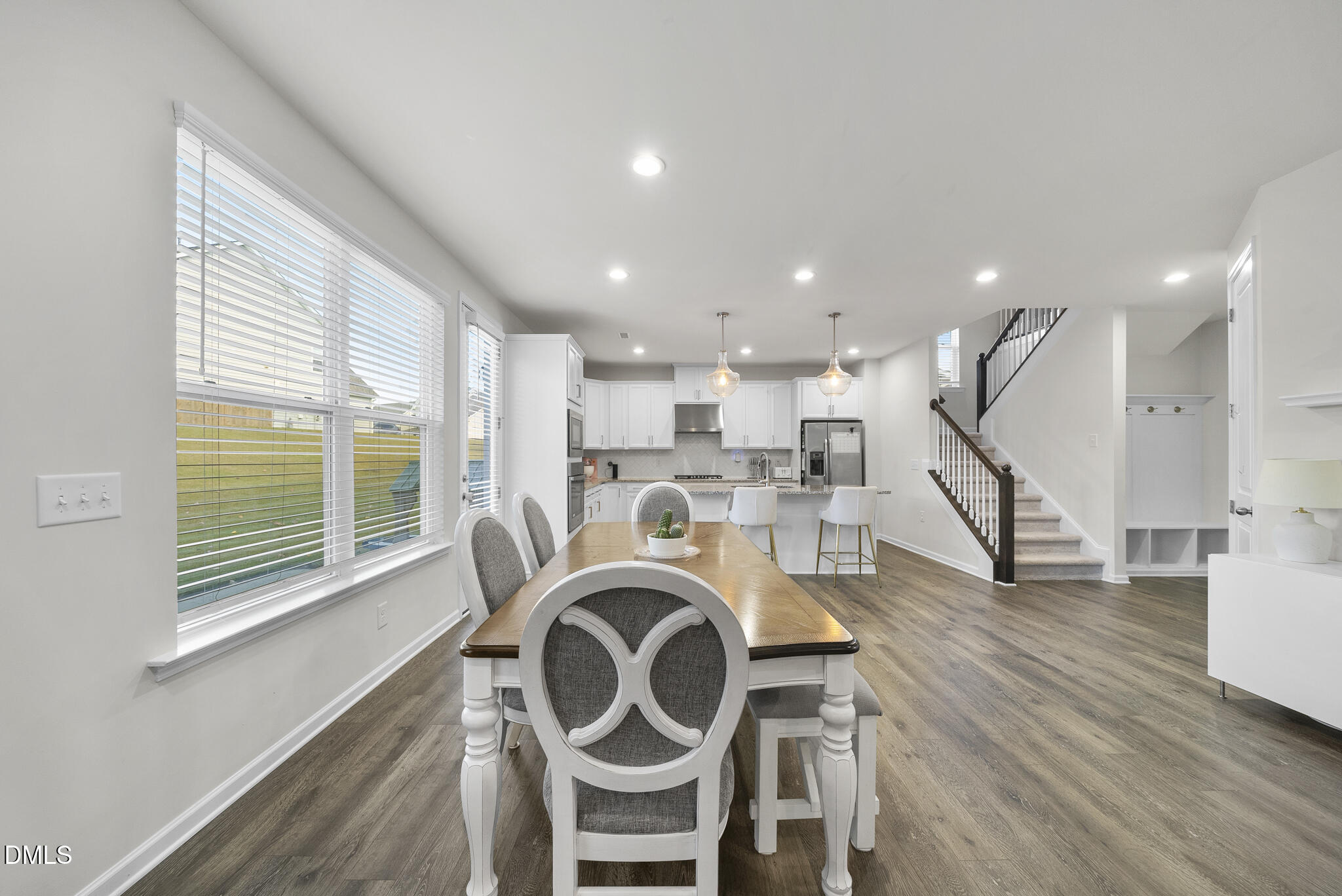 672 Millers Mark Avenue Wake Forest, NC 27587 - Photo 16 of 41 a view of kitchen and hall with wooden floor
