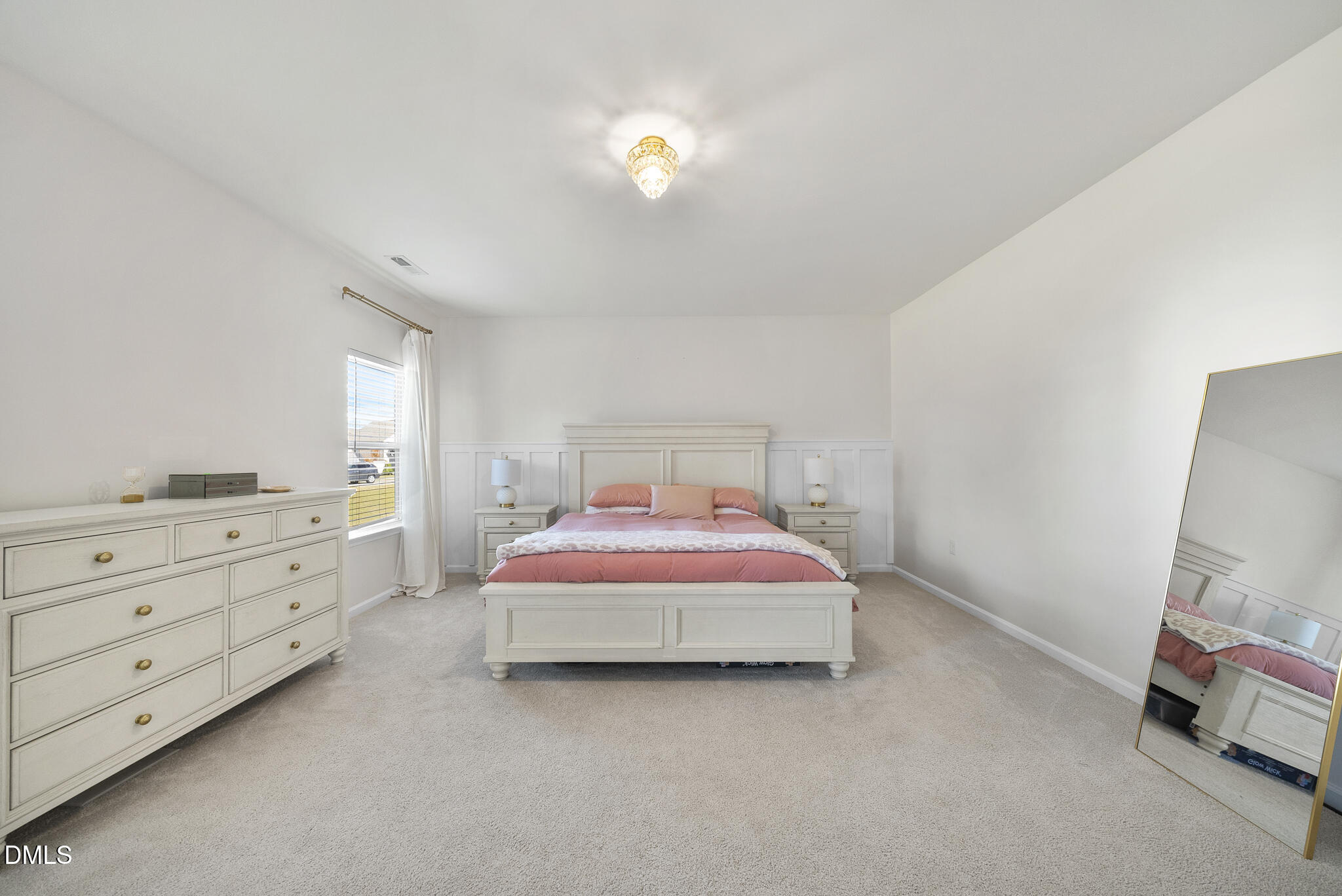 672 Millers Mark Avenue Wake Forest, NC 27587 - Photo 17 of 41 a bedroom with a bed and a chandelier fan