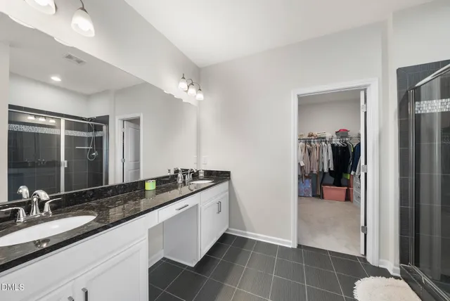 a bathroom with a bathtub and a window