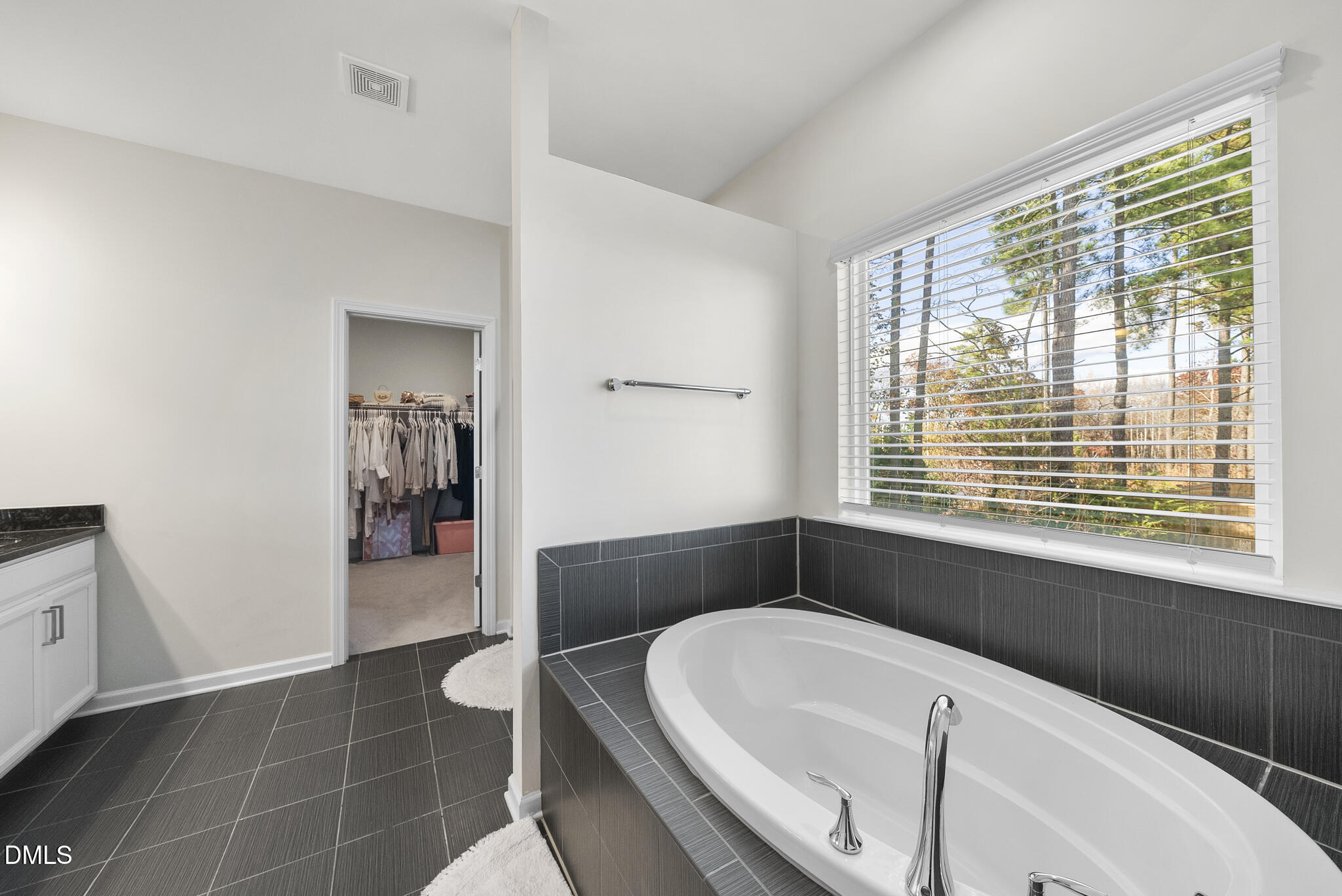 672 Millers Mark Avenue Wake Forest, NC 27587 - Photo 20 of 41 a bathroom with a bathtub and a window