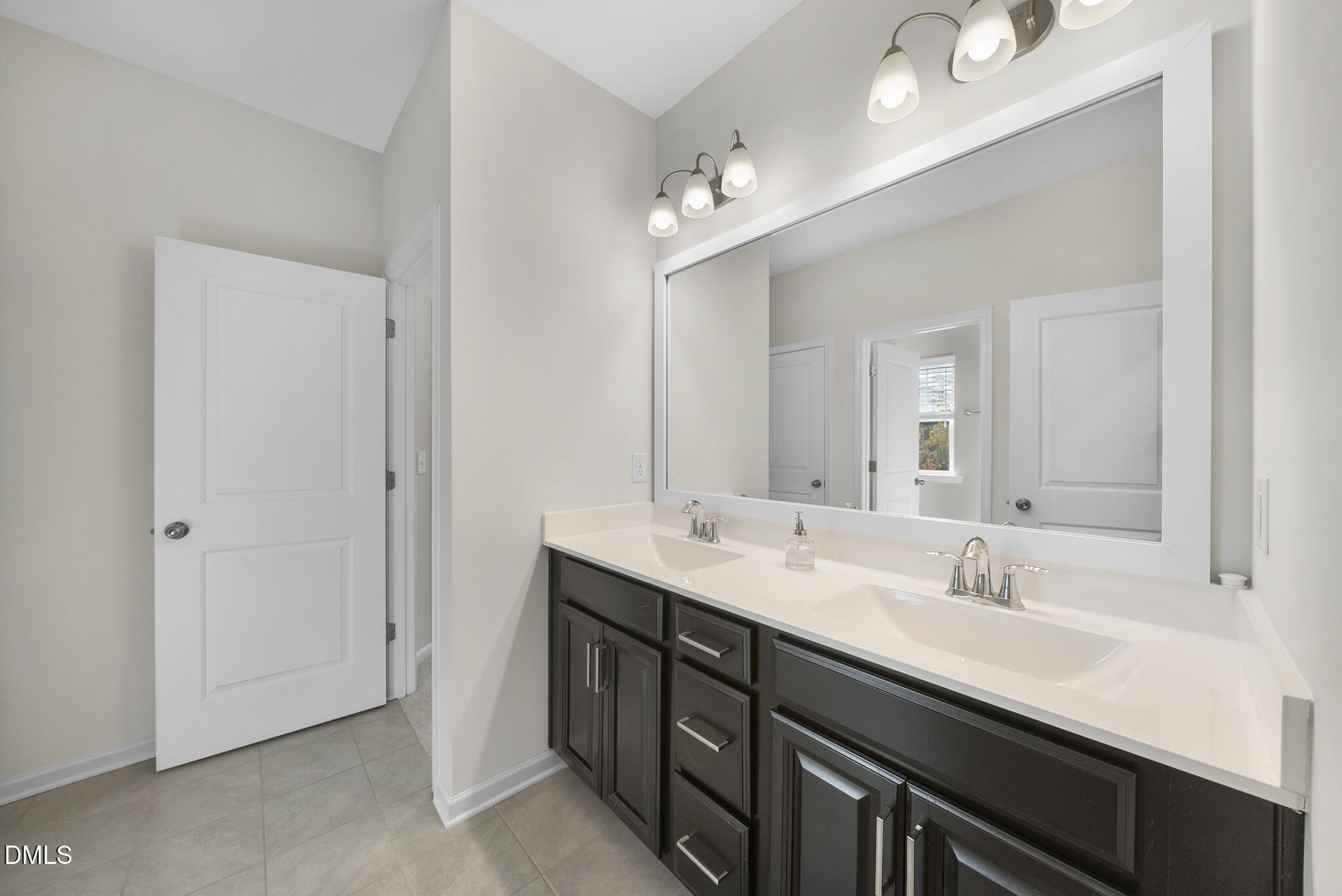 672 Millers Mark Avenue Wake Forest, NC 27587 - Photo 29 of 41 a bathroom with a sink double vanity and a mirror