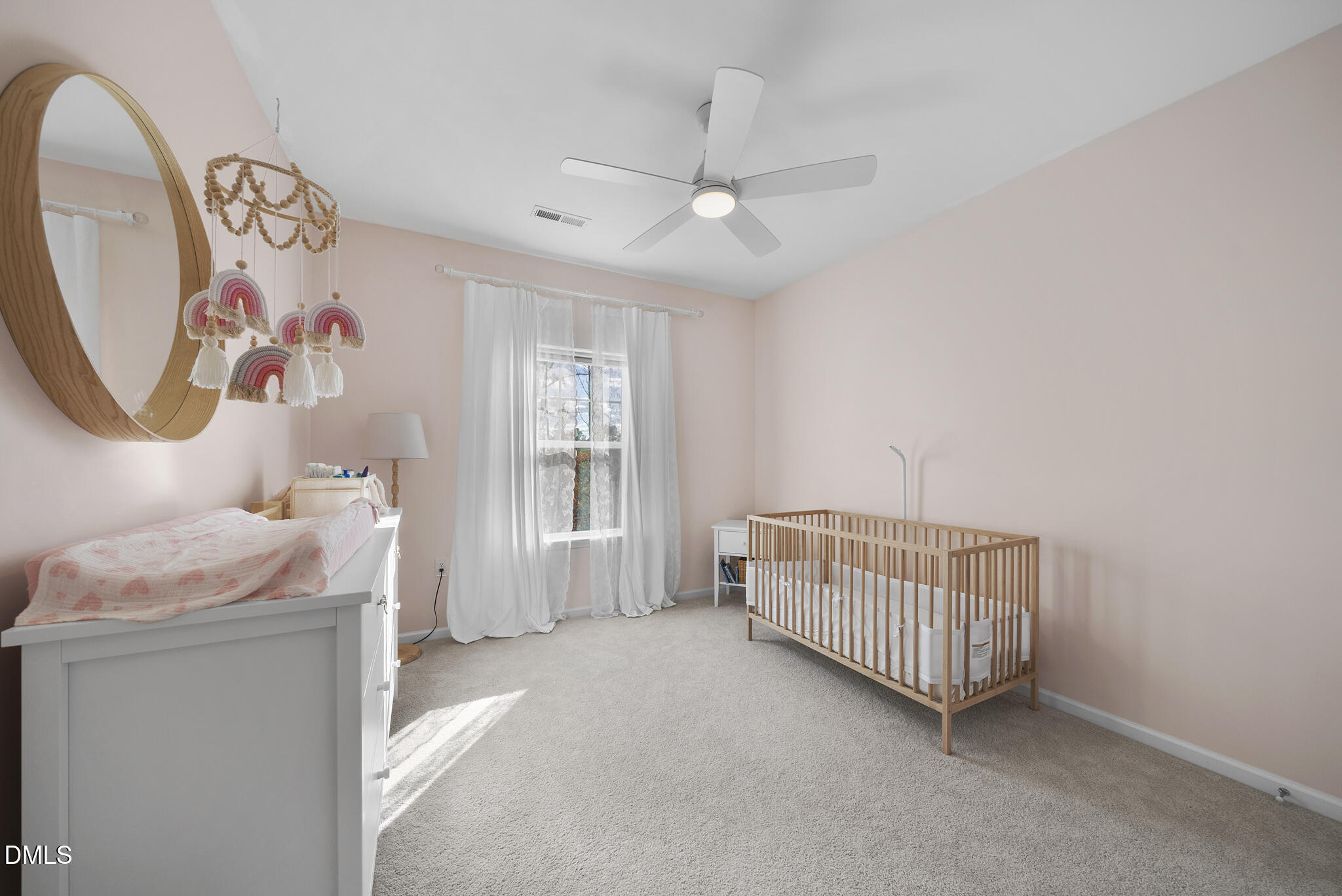 672 Millers Mark Avenue Wake Forest, NC 27587 - Photo 30 of 41 a bedroom with a baby bed a chandelier and a window
