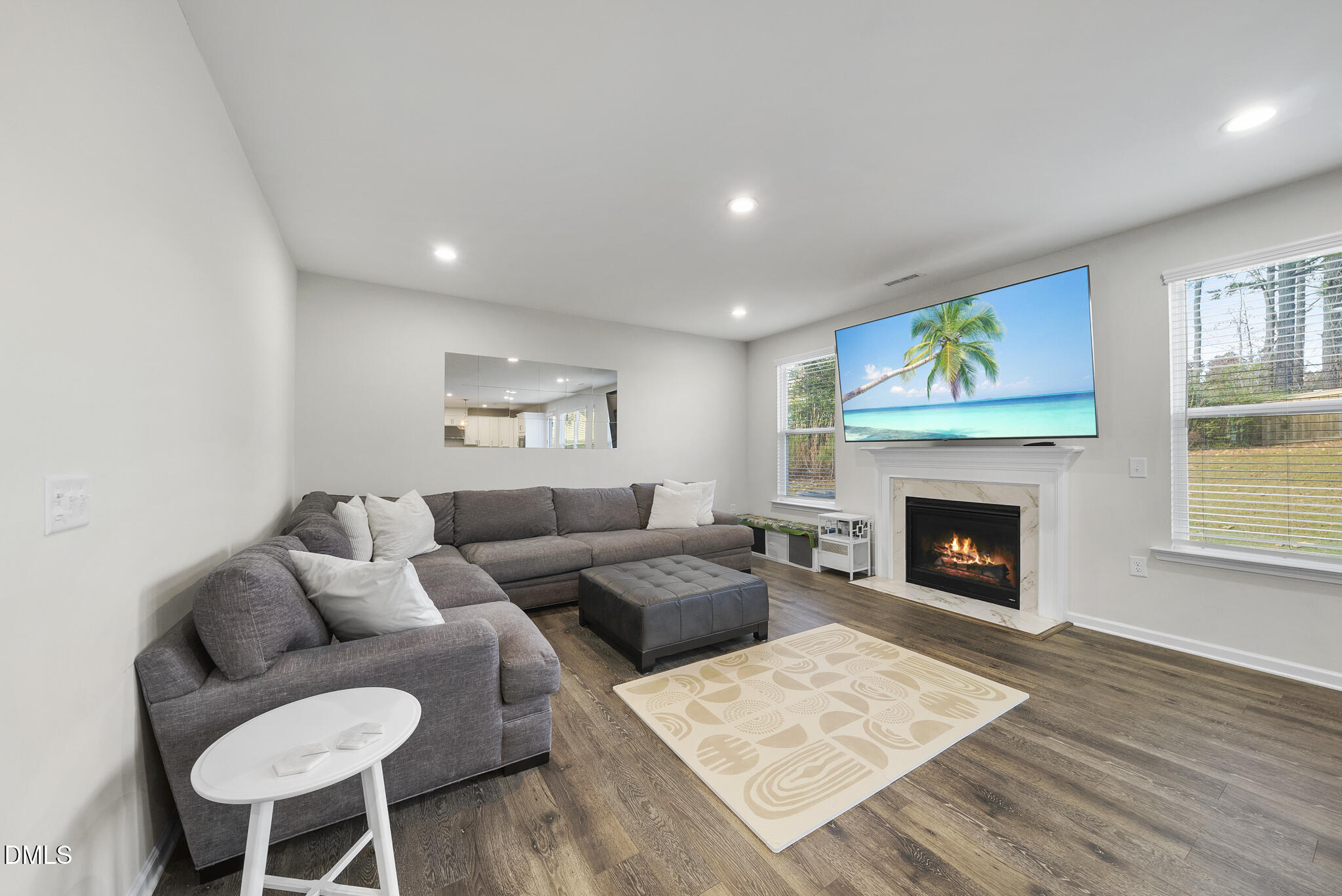 672 Millers Mark Avenue Wake Forest, NC 27587 - Photo 5 of 41 a living room with furniture and a fireplace
