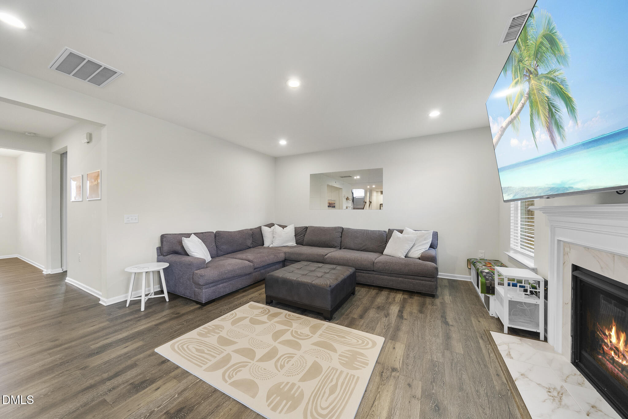 672 Millers Mark Avenue Wake Forest, NC 27587 - Photo 6 of 41 a living room with furniture and a fireplace
