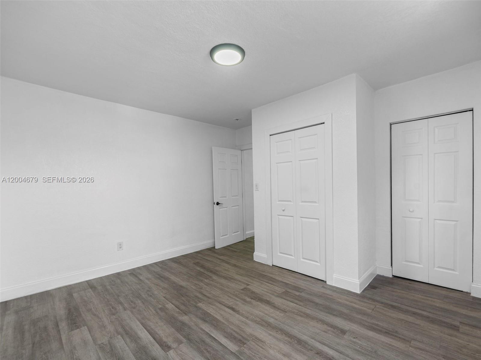 500 Southwest 8th Street Miami, FL 33130 - Photo 13 of 33 a view of an empty room and wooden floor