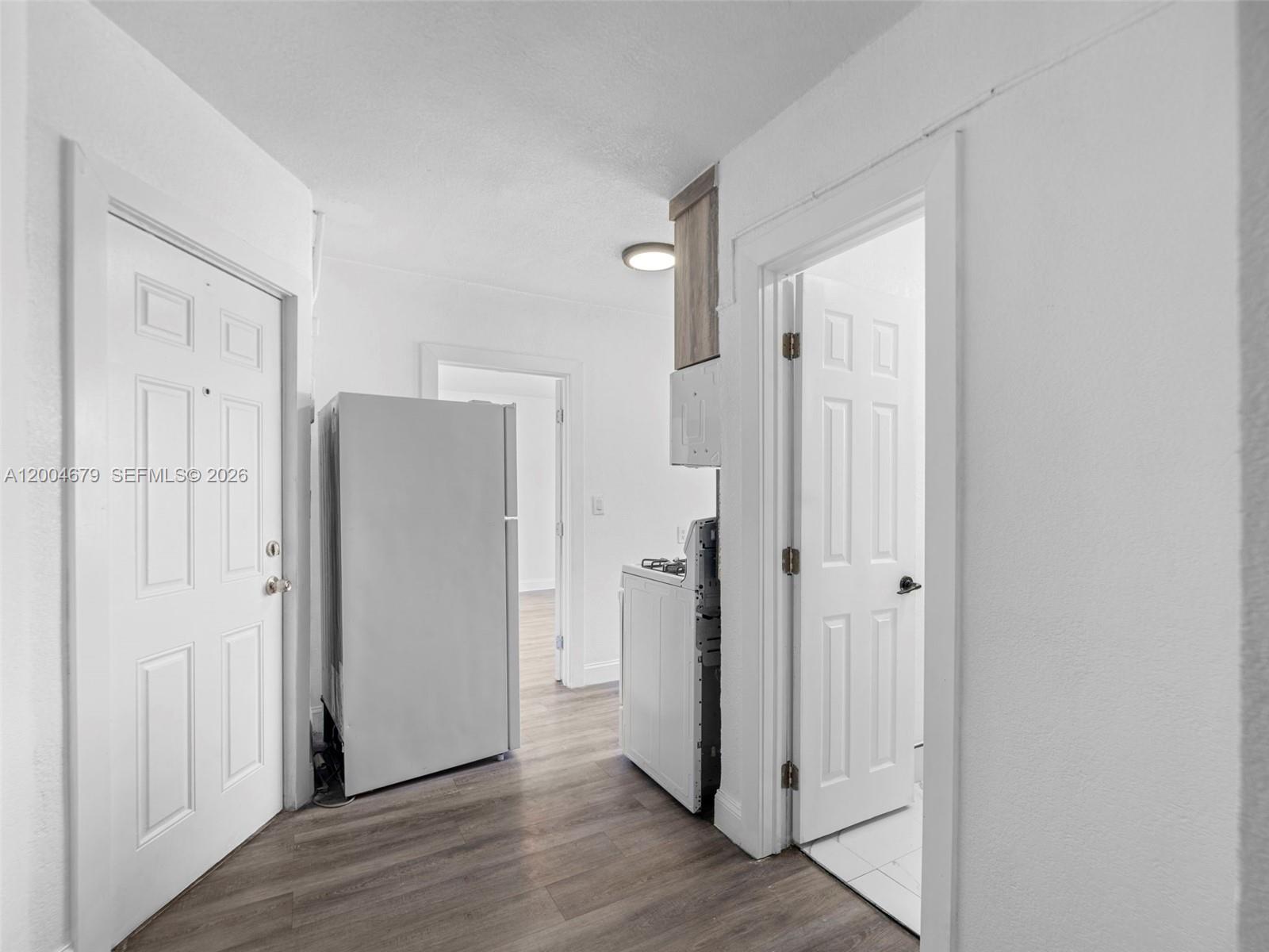 500 Southwest 8th Street Miami, FL 33130 - Photo 16 of 33 a view of a hallway with wooden floor