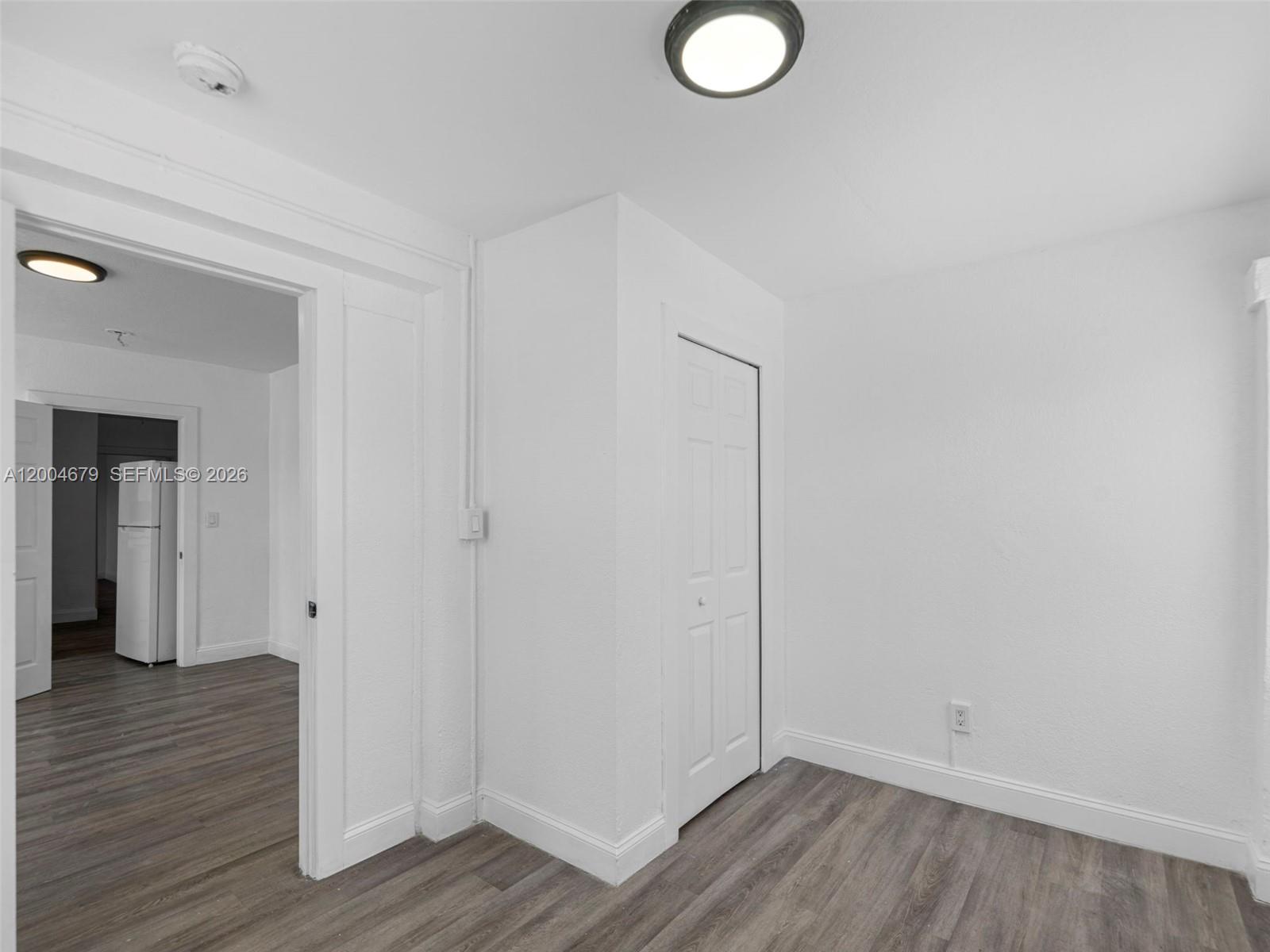 500 Southwest 8th Street Miami, FL 33130 - Photo 24 of 33 a view of empty room with wooden floor