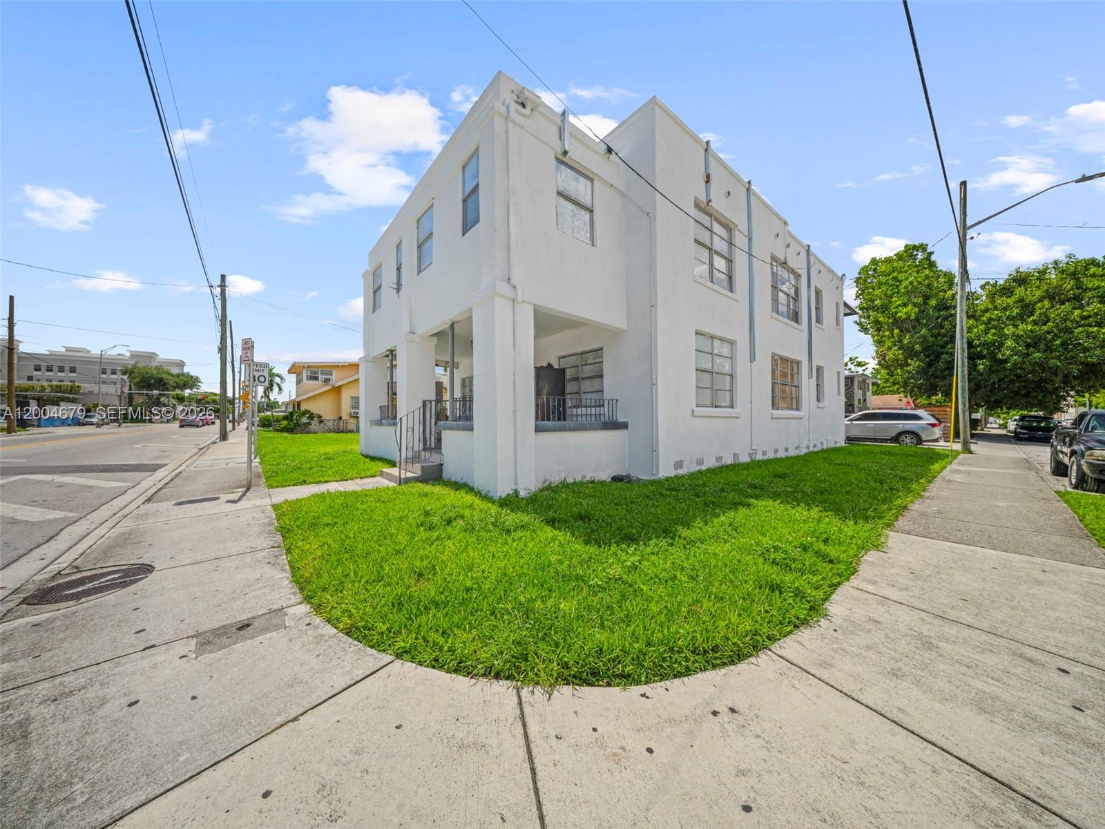 500 Southwest 8th Street Miami, FL 33130 - Photo 3 of 33 a view of a white house with a small garden