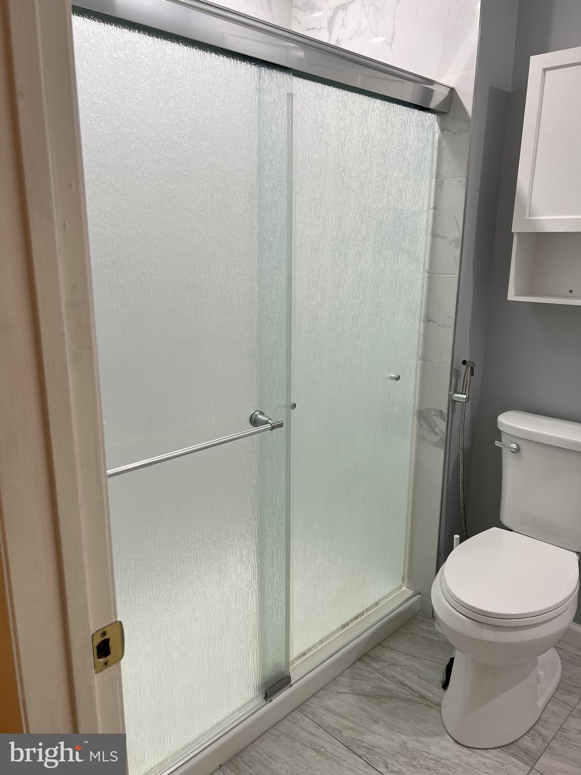 109 Pebble Road East Windsor, NJ 08520 - Photo 40 of 61 a white toilet sitting next to a shower