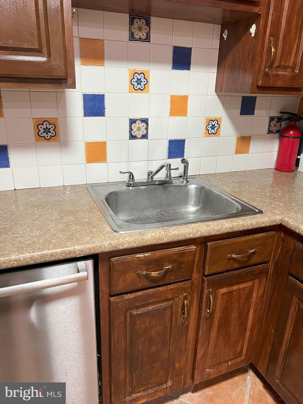 109 Pebble Road East Windsor, NJ 08520 - Photo 58 of 61 a view of a kitchen with granite countertop a sink and a wooden cabinets