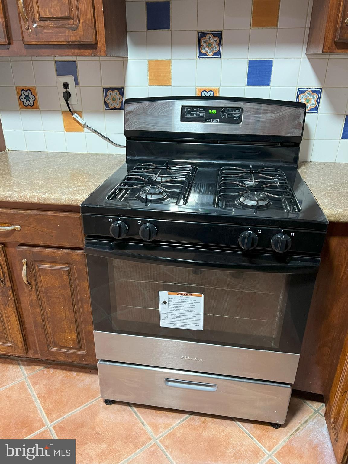 109 Pebble Road East Windsor, NJ 08520 - Photo 60 of 61 a stove top oven sitting inside of a kitchen