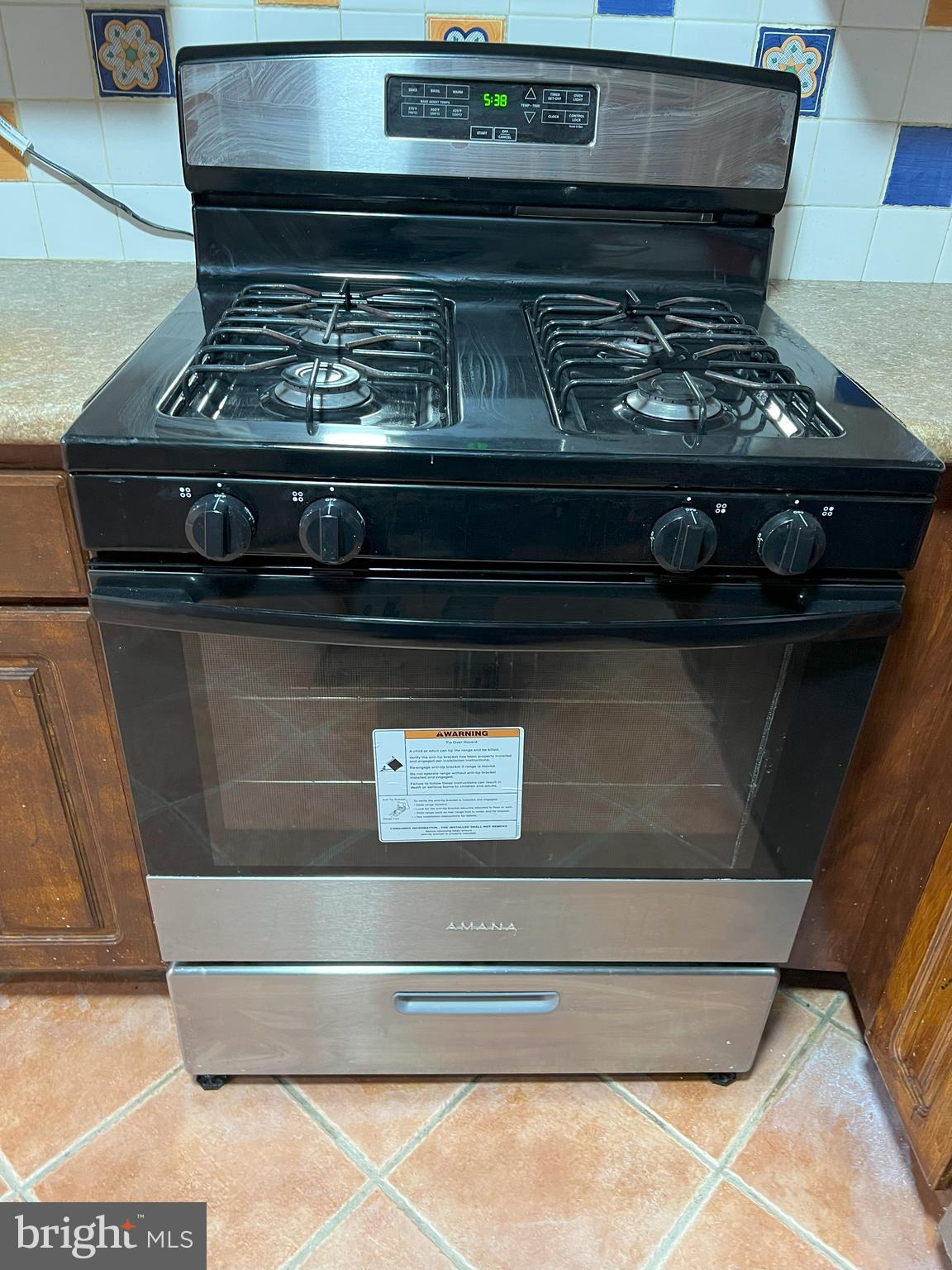 109 Pebble Road East Windsor, NJ 08520 - Photo 61 of 61 a stove top oven sitting inside of a kitchen