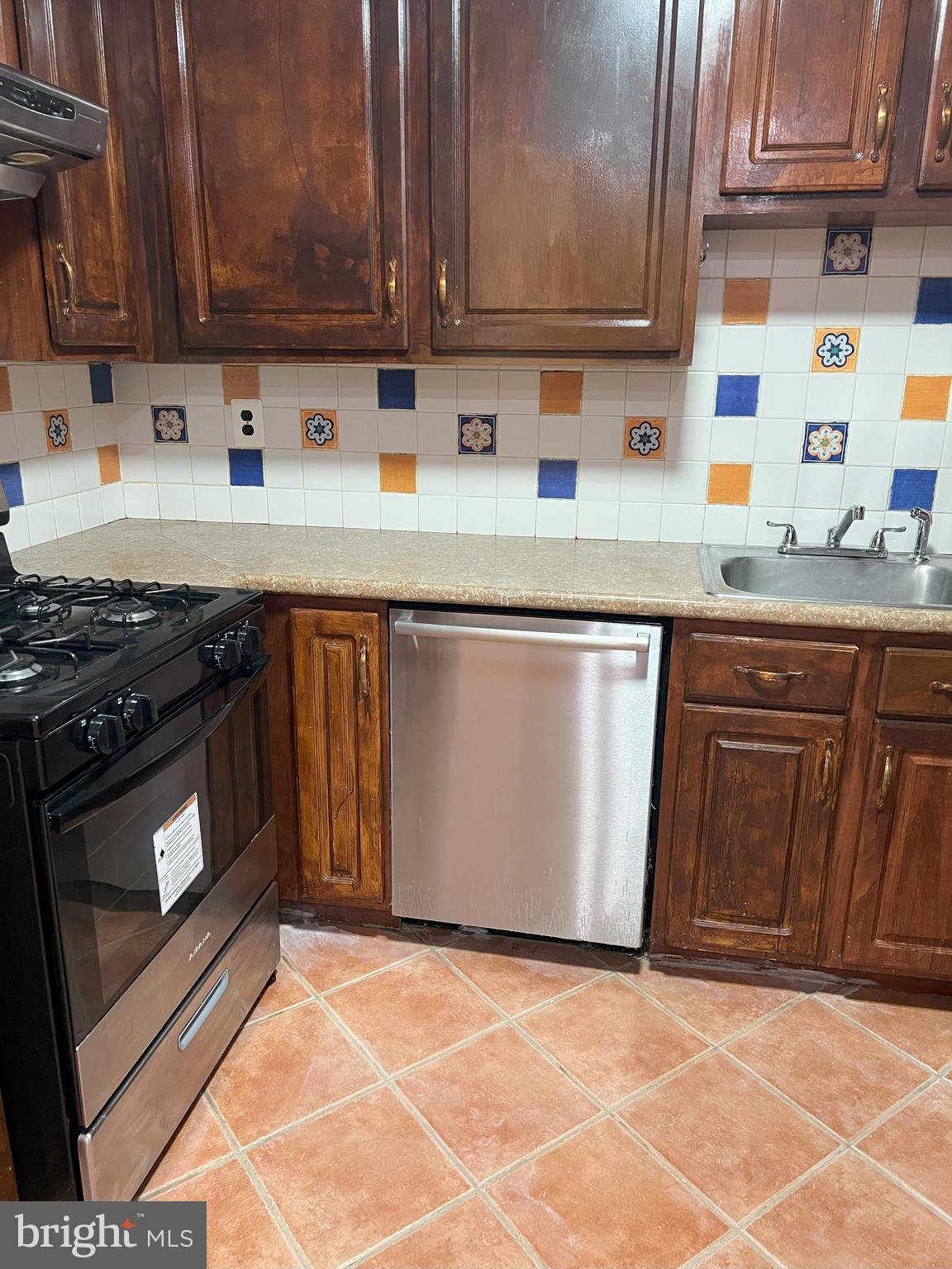 109 Pebble Road East Windsor, NJ 08520 - Photo 9 of 61 a kitchen with stainless steel appliances granite countertop a stove a sink and a microwave