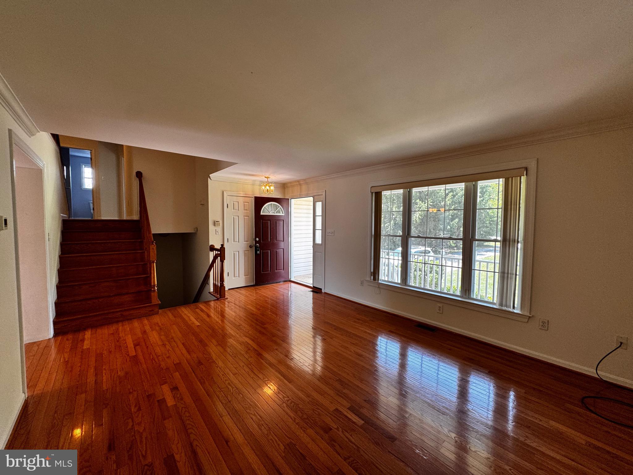 2653 Sandymount Road Finksburg, MD 21048 - Photo 21 of 68 a view of an empty room with wooden floor and a window