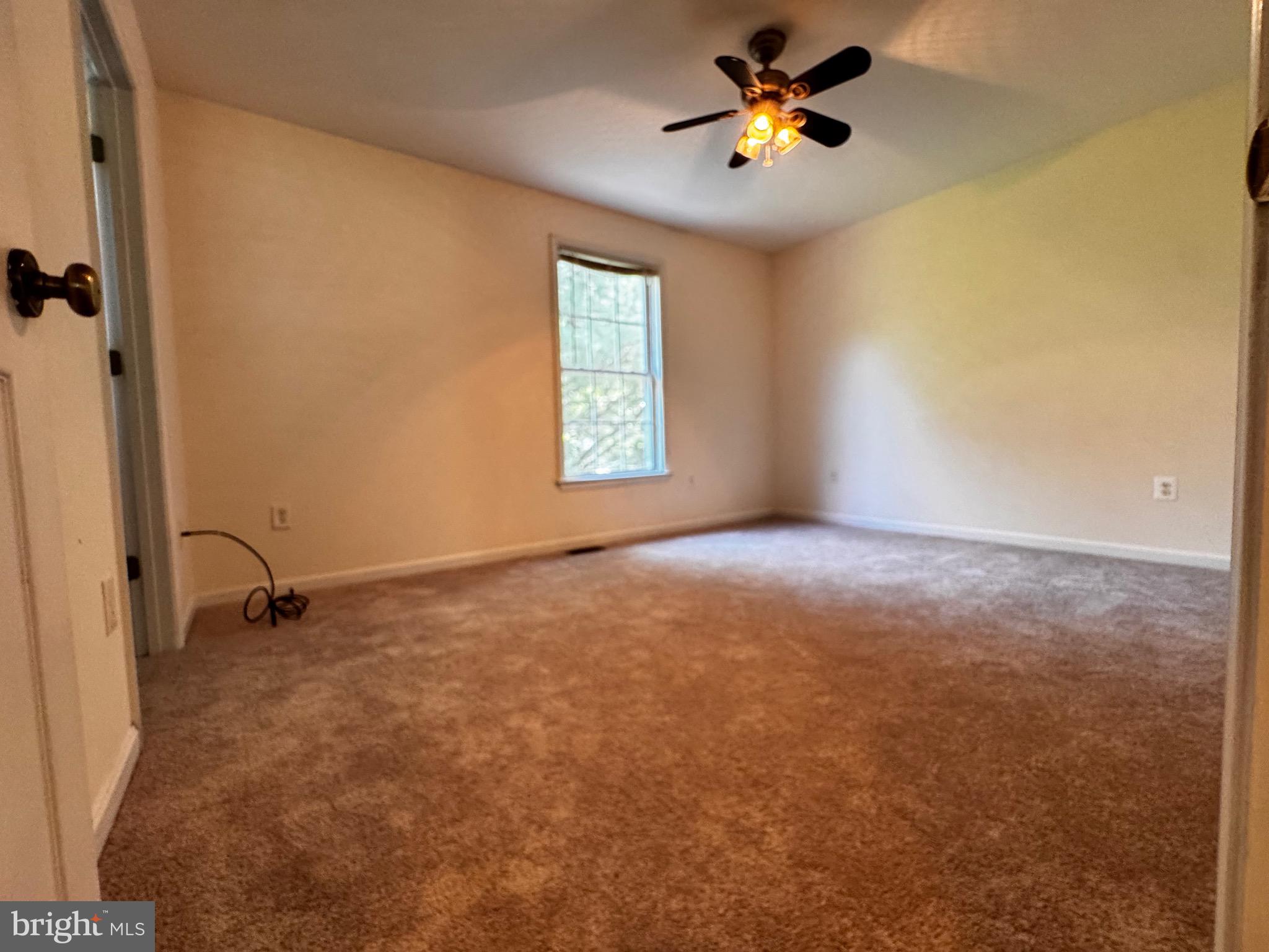 2653 Sandymount Road Finksburg, MD 21048 - Photo 27 of 68 wooden floor in an empty room with a window