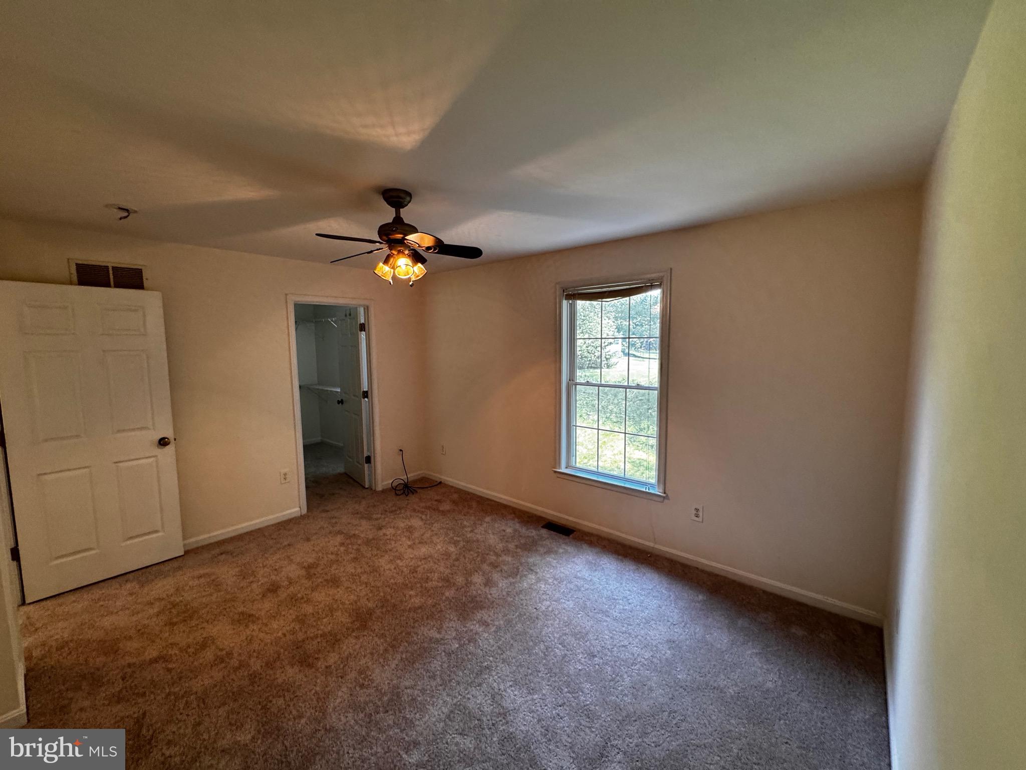 2653 Sandymount Road Finksburg, MD 21048 - Photo 29 of 68 a view of a livingroom with a ceiling fan and window