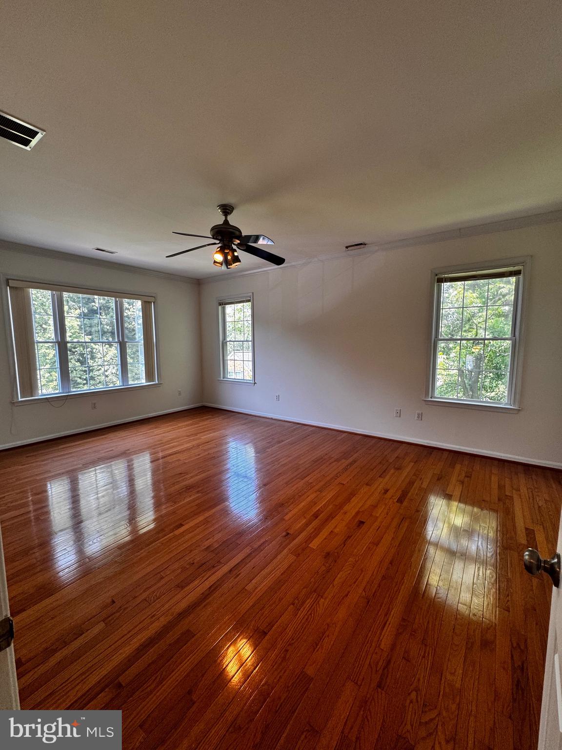 2653 Sandymount Road Finksburg, MD 21048 - Photo 39 of 68 a view of an empty room with wooden floor and a window