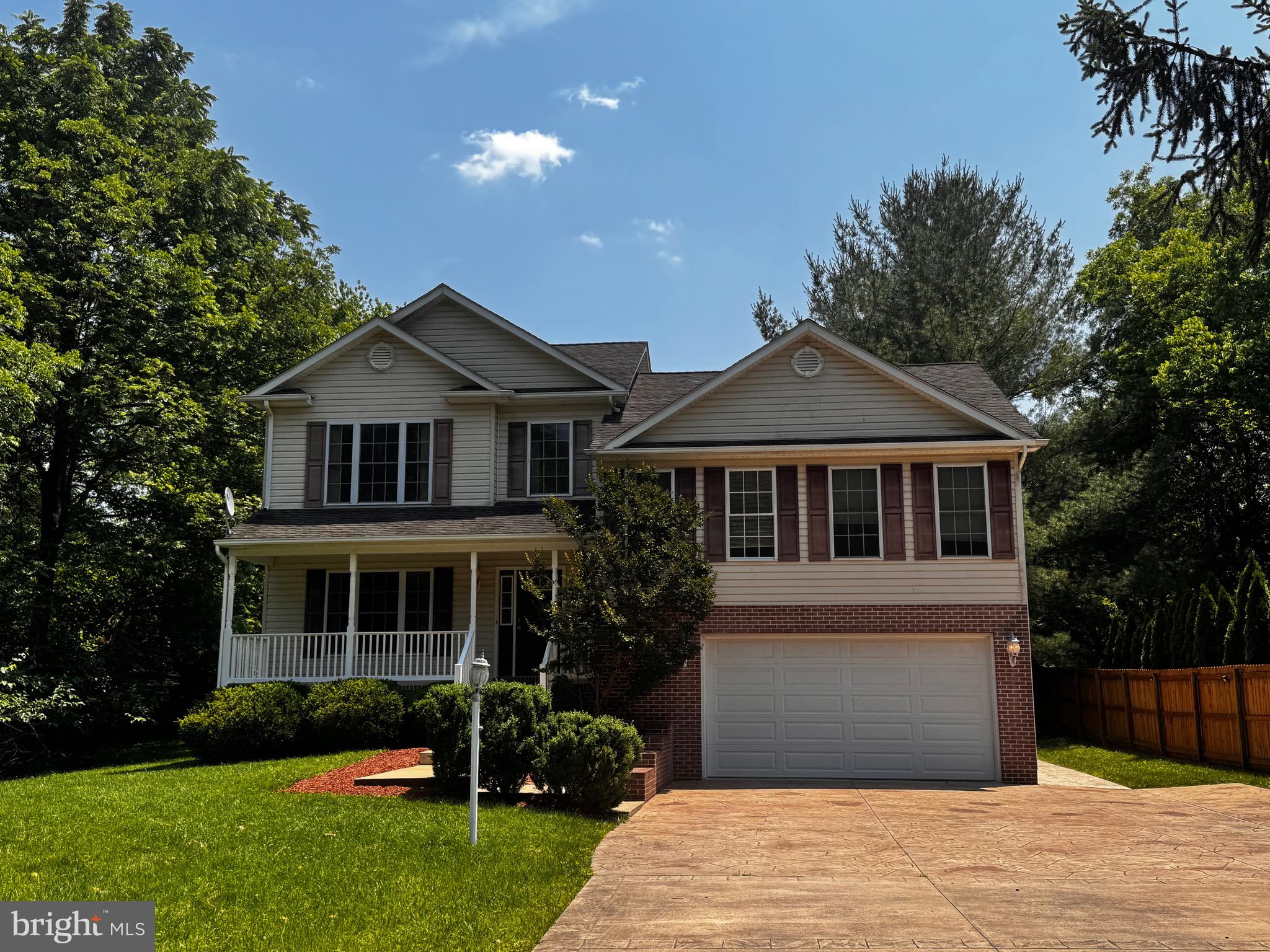2653 Sandymount Road Finksburg, MD 21048 - Photo 4 of 68 a front view of a house with a garden and yard