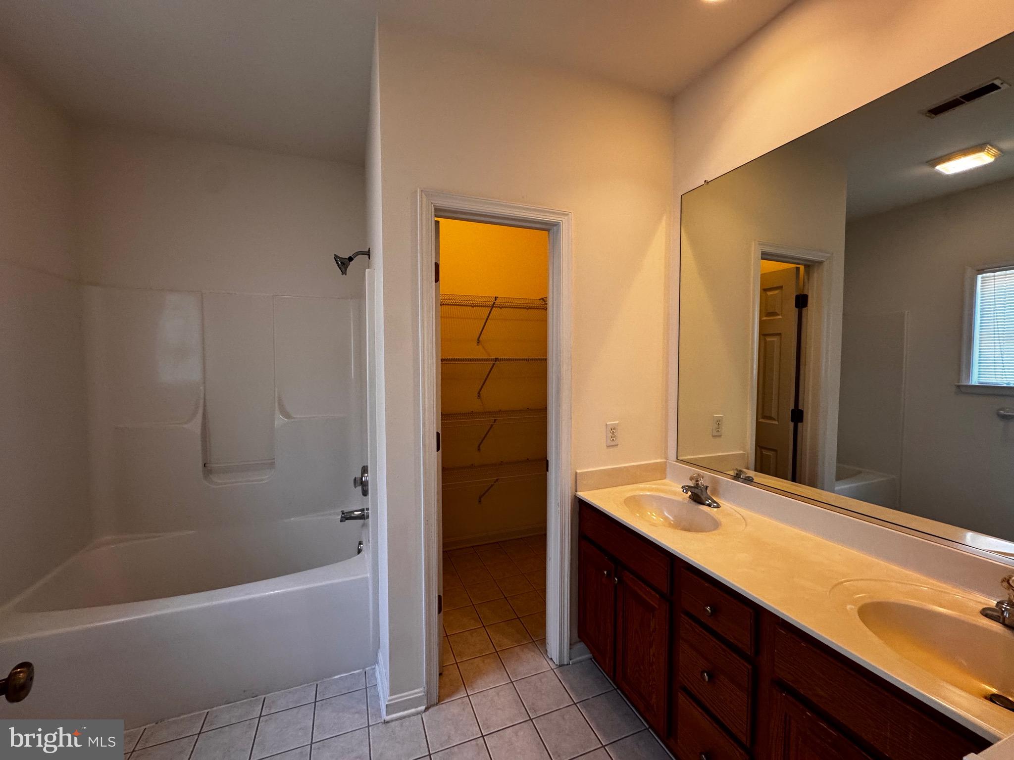 2653 Sandymount Road Finksburg, MD 21048 - Photo 44 of 68 a bathroom with a tub sink shower and two mirror