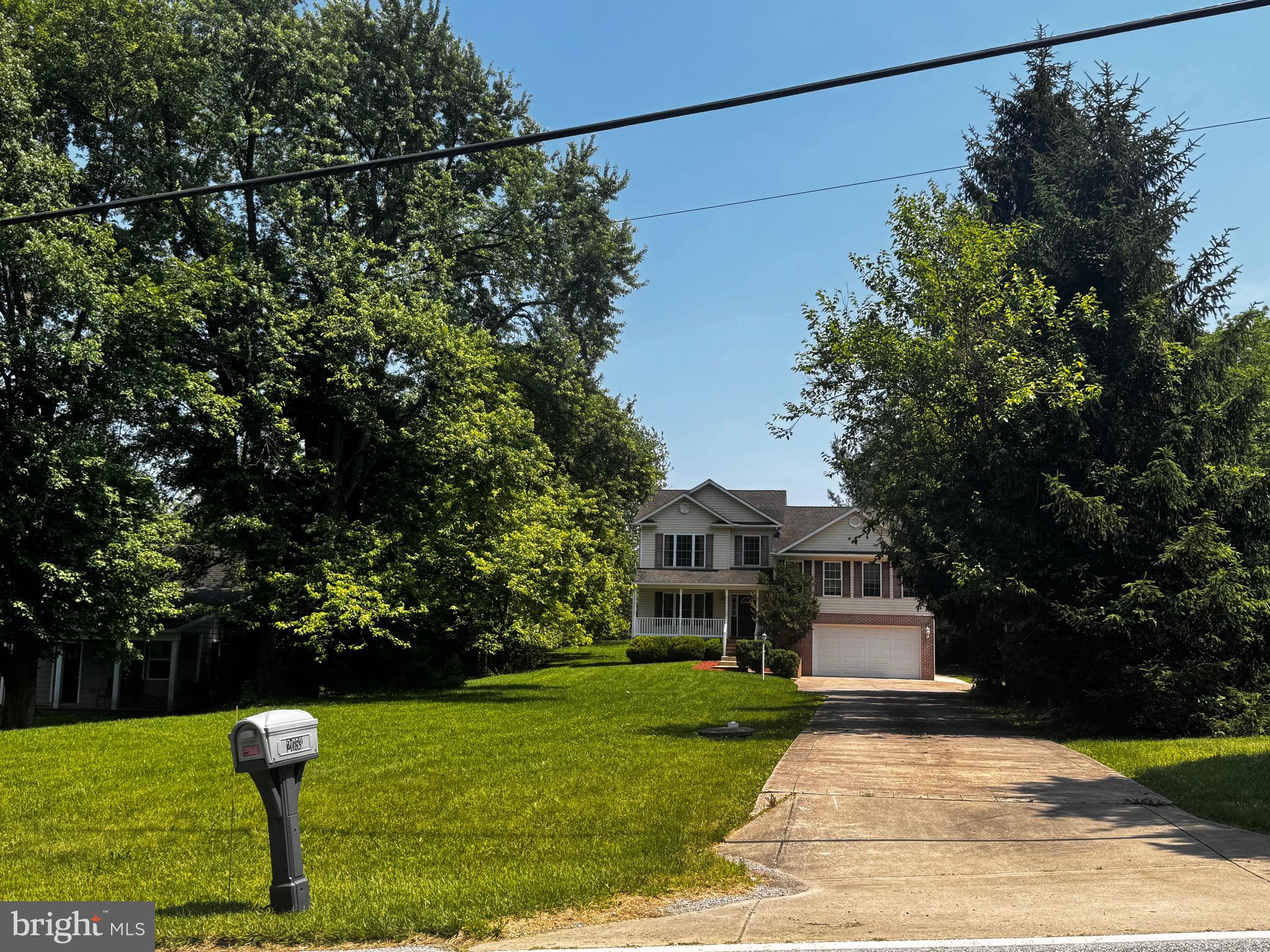 2653 Sandymount Road Finksburg, MD 21048 - Photo 8 of 68 a front view of a house with a yard