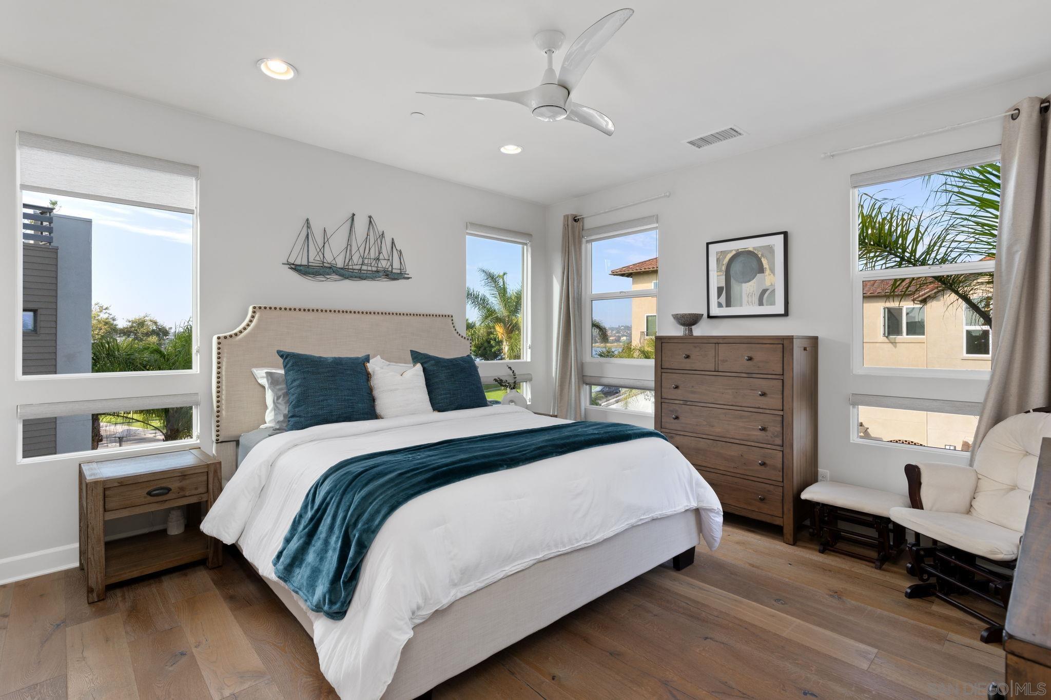 2521 Ate Street Carlsbad, CA 92008 - Photo 20 of 30 a bedroom with a large bed and a window