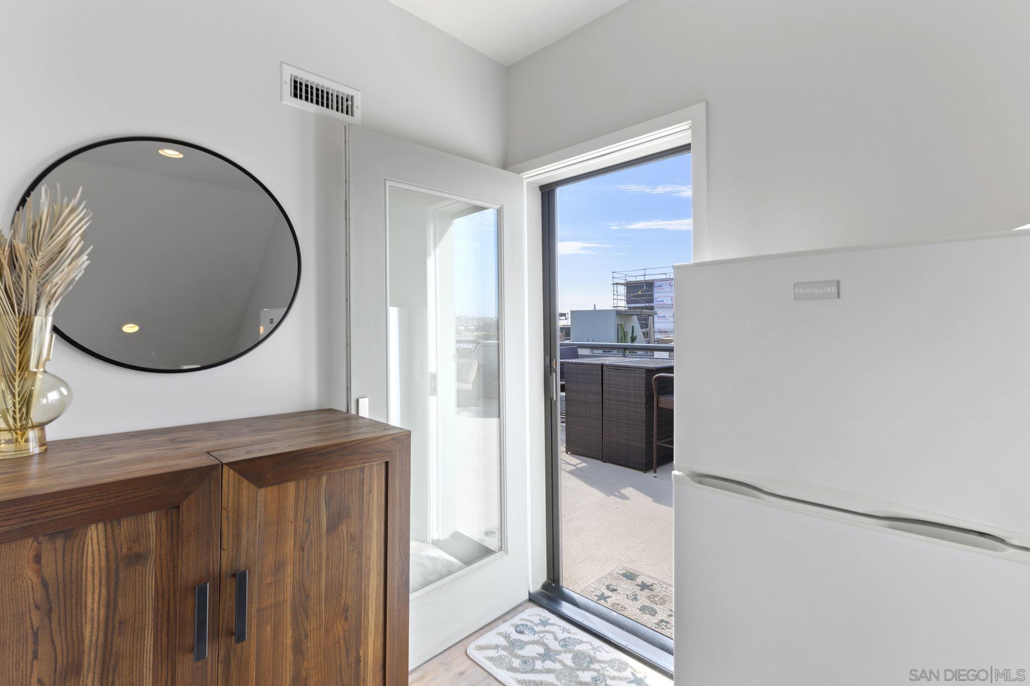2521 Ate Street Carlsbad, CA 92008 - Photo 24 of 30 a kitchen with stainless steel appliances granite countertop a refrigerator a stove and a sink with granite countertops