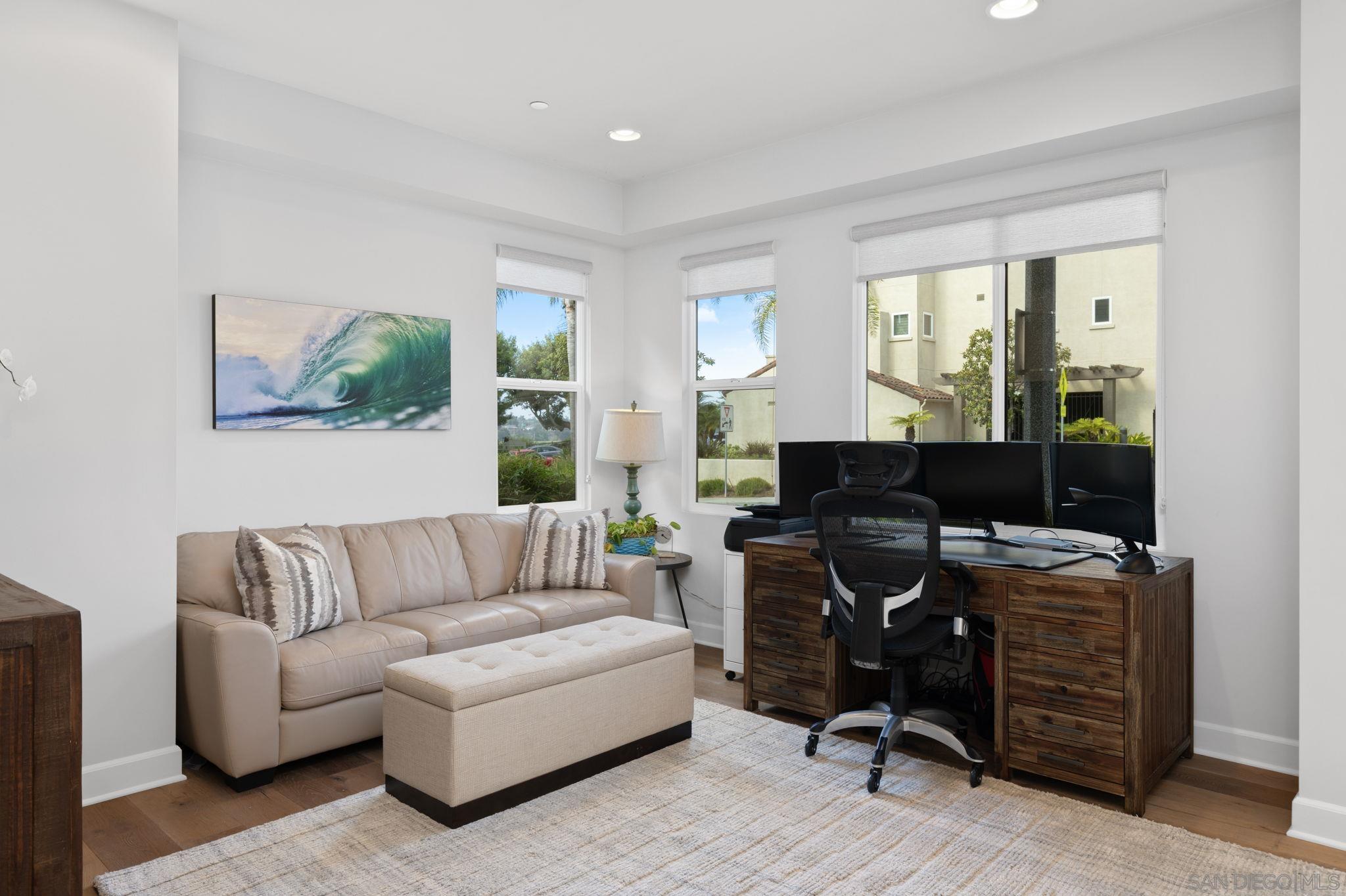 2521 Ate Street Carlsbad, CA 92008 - Photo 6 of 30 a living room with furniture and a workspace