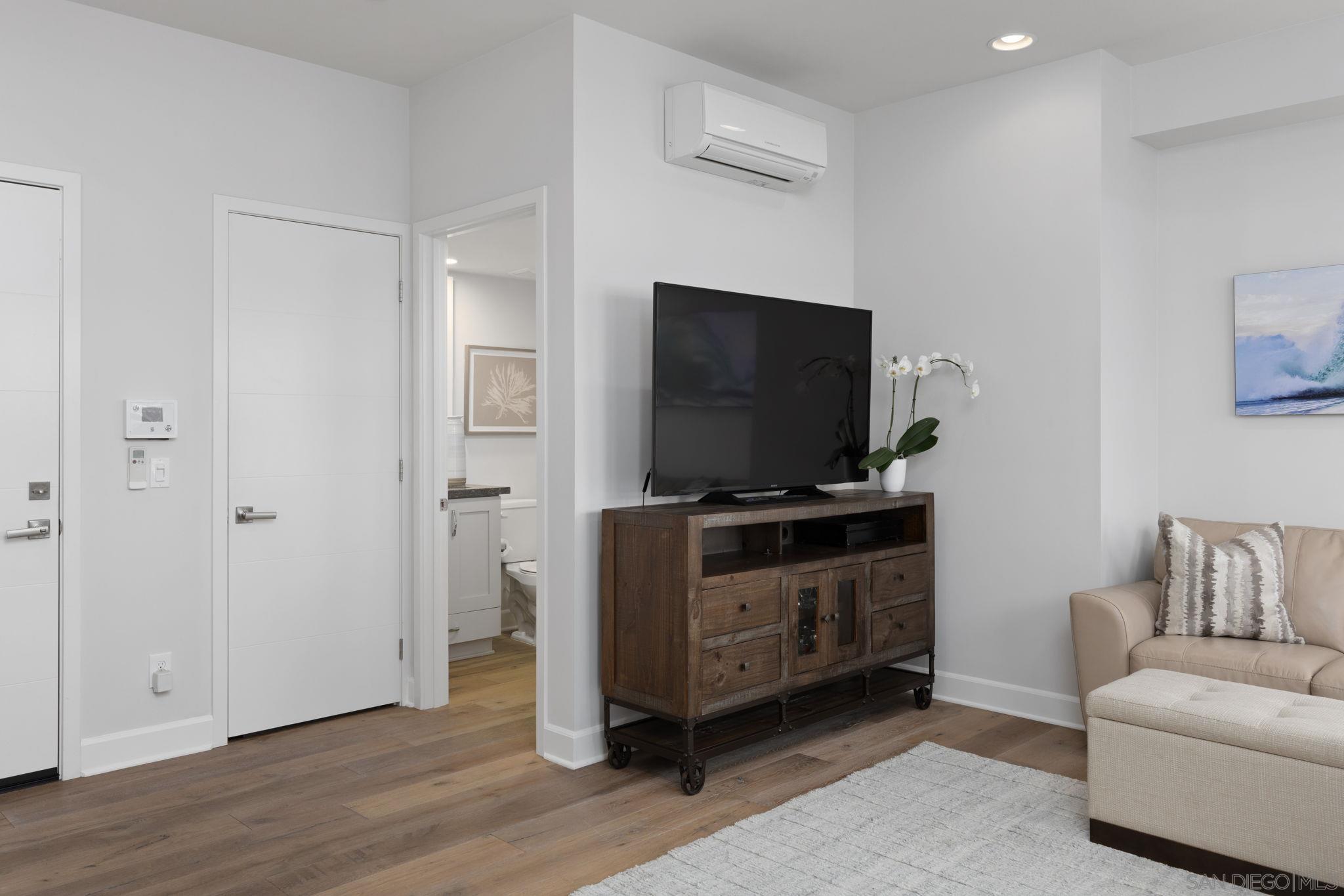 2521 Ate Street Carlsbad, CA 92008 - Photo 7 of 30 a living room with furniture and a flat screen tv