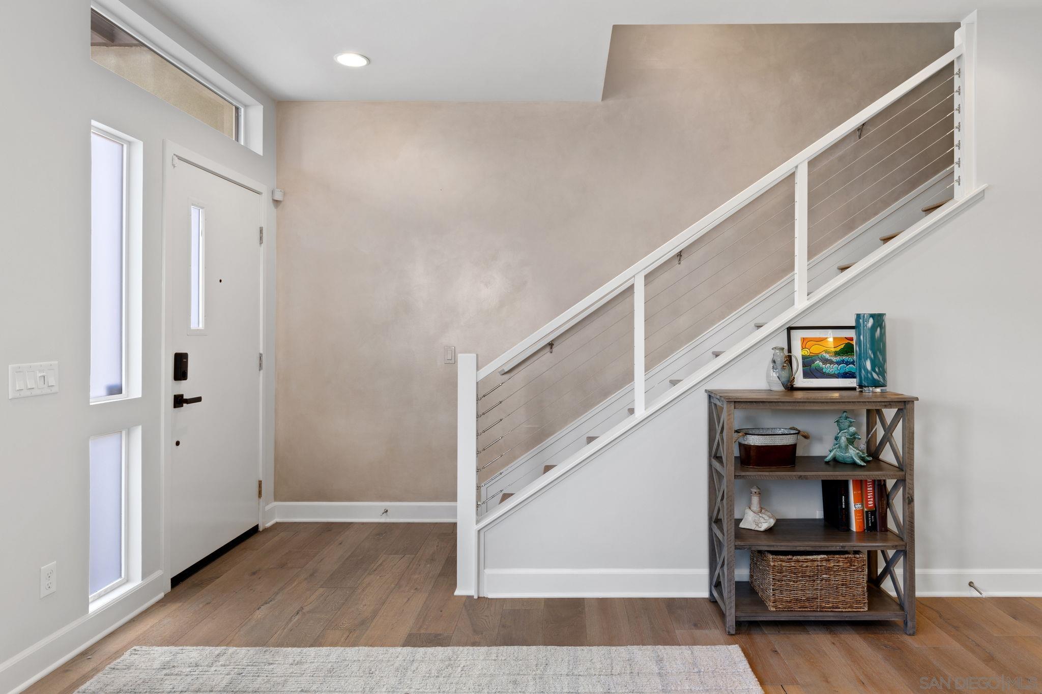 2521 Ate Street Carlsbad, CA 92008 - Photo 8 of 30 a view of hallway with stairs and wooden floor