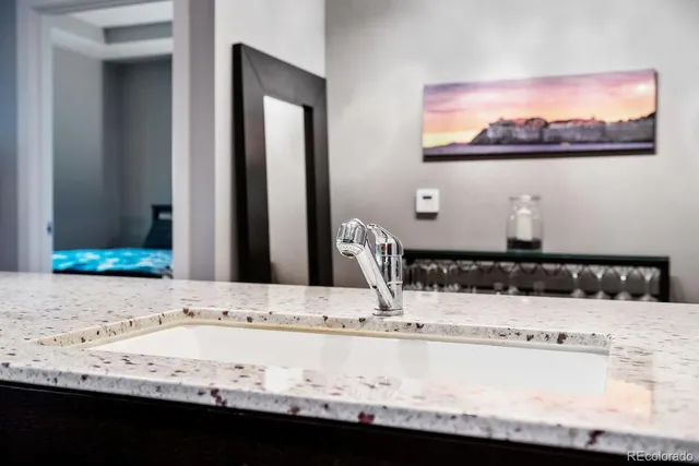 a kitchen with stainless steel appliances granite countertop a stove and a microwave