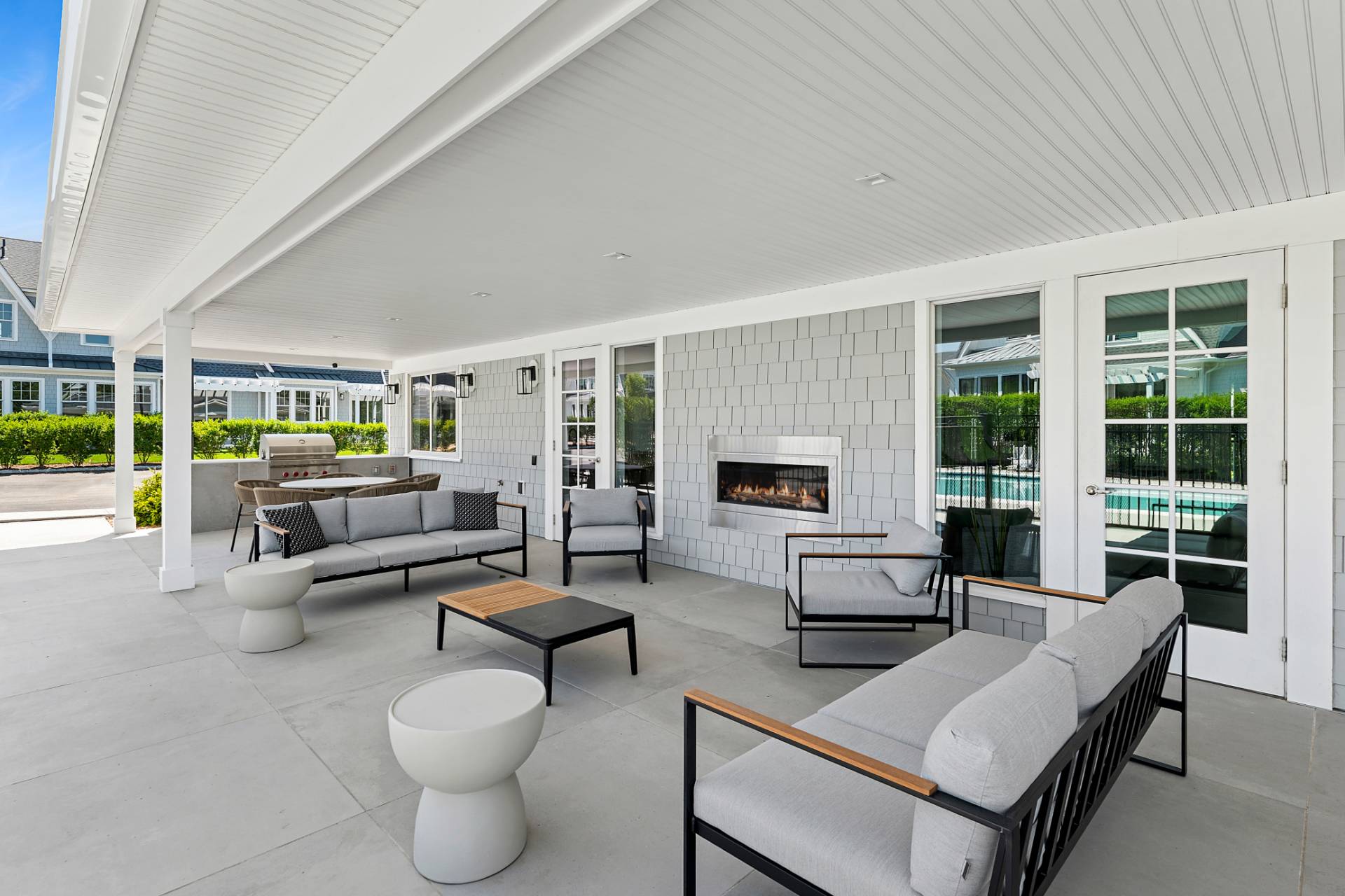 12 Depot Road, Unit 102 Westhampton Beach, NY 11978 - Photo 16 of 17 a living room with furniture and a large window