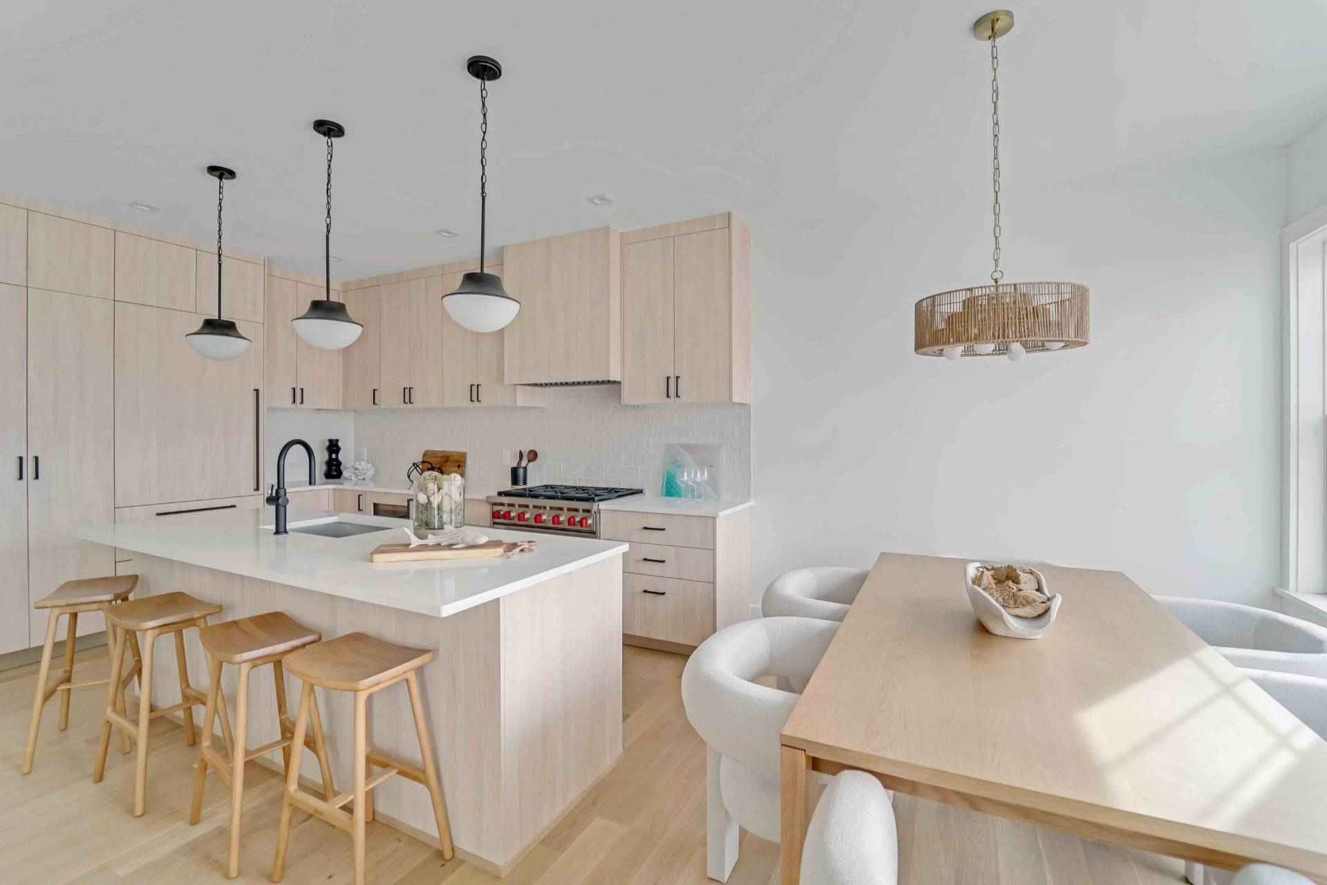 12 Depot Road, Unit 102 Westhampton Beach, NY 11978 - Photo 4 of 17 a view of a kitchen area with furniture and floor to ceiling window