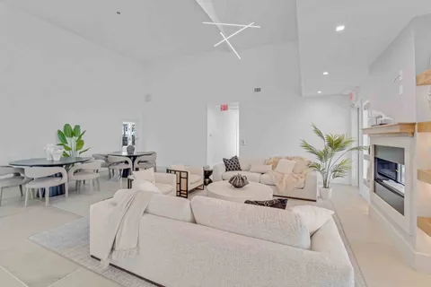 a living room with furniture fireplace and a fireplace