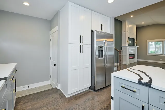 a bathroom with a shower sink and mirror